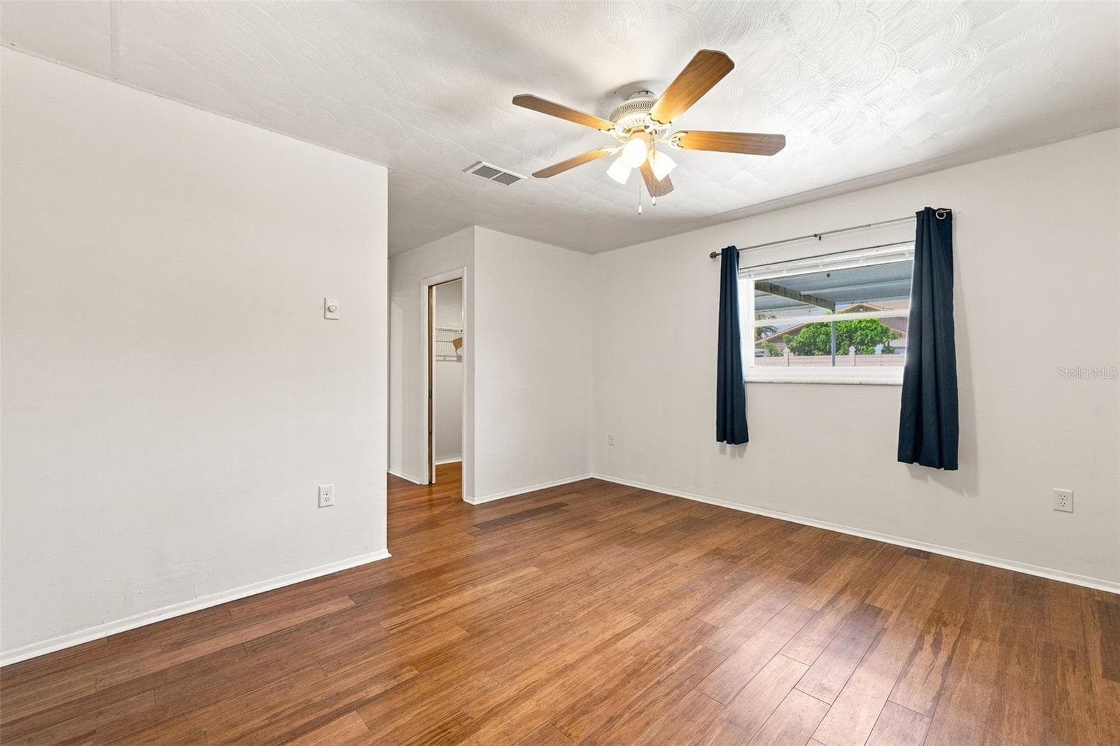 Primary Bedroom with walk in closet - 4331 SWALLOWTAIL DR, NEW PORT RICHEY