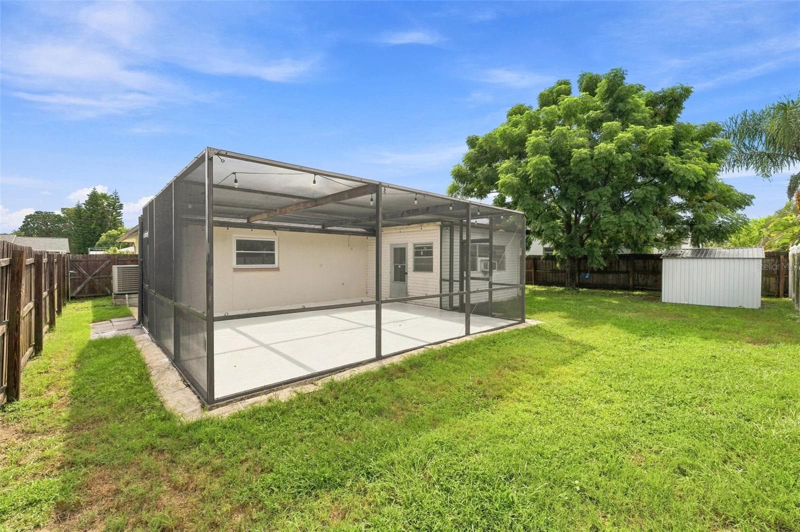 Extended screened lanai patio, shed for storage and yard - 4331 SWALLOWTAIL DR, NEW PORT RICHEY