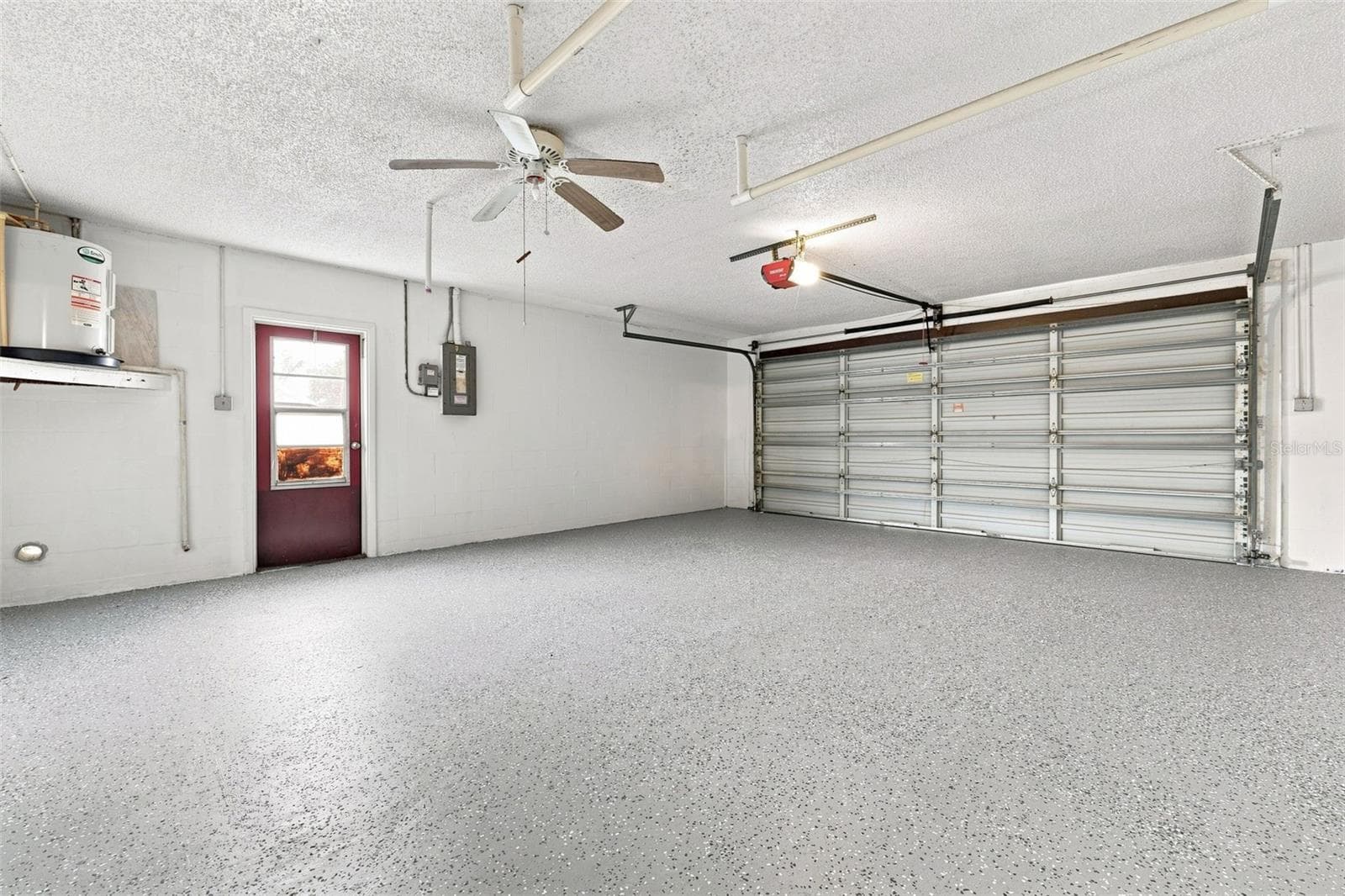 Garage with epoxy finished floors - 4331 SWALLOWTAIL DR, NEW PORT RICHEY