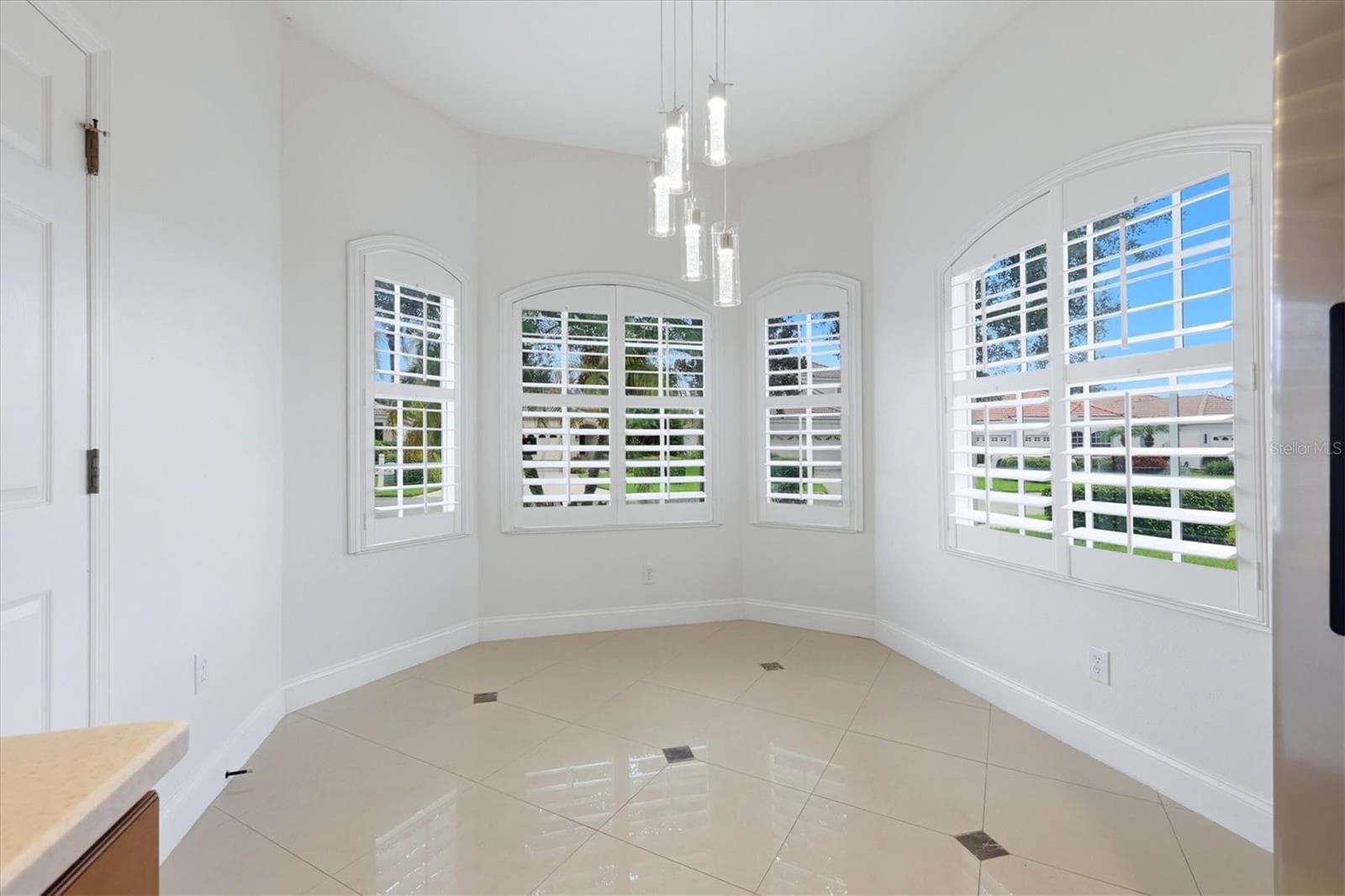 Dinette Area with Bay Window and Plantation Shutters - 7519 BIRDS EYE TER, BRADENTON