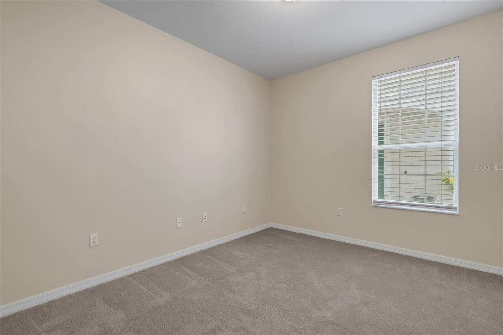 Bedroom #2 also has a tall window beautiful natural light. - 684 GRASSLANDS VILLAGE CIR, LAKELAND