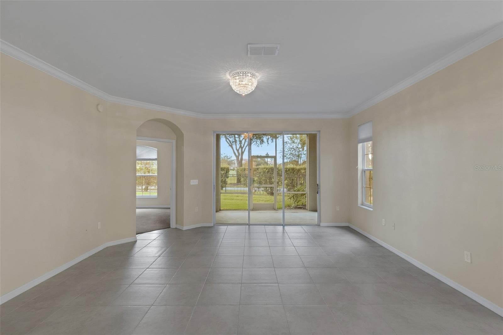 The large greatroom allows for multiple furniture arrangements . . . - 684 GRASSLANDS VILLAGE CIR, LAKELAND