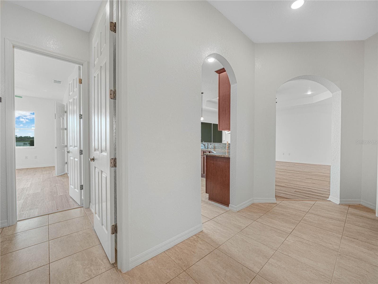 Hallway from Kitchen to 2nd Primary Suite - 6136 PEBBLE BEACH BLVD, WINTER HAVEN