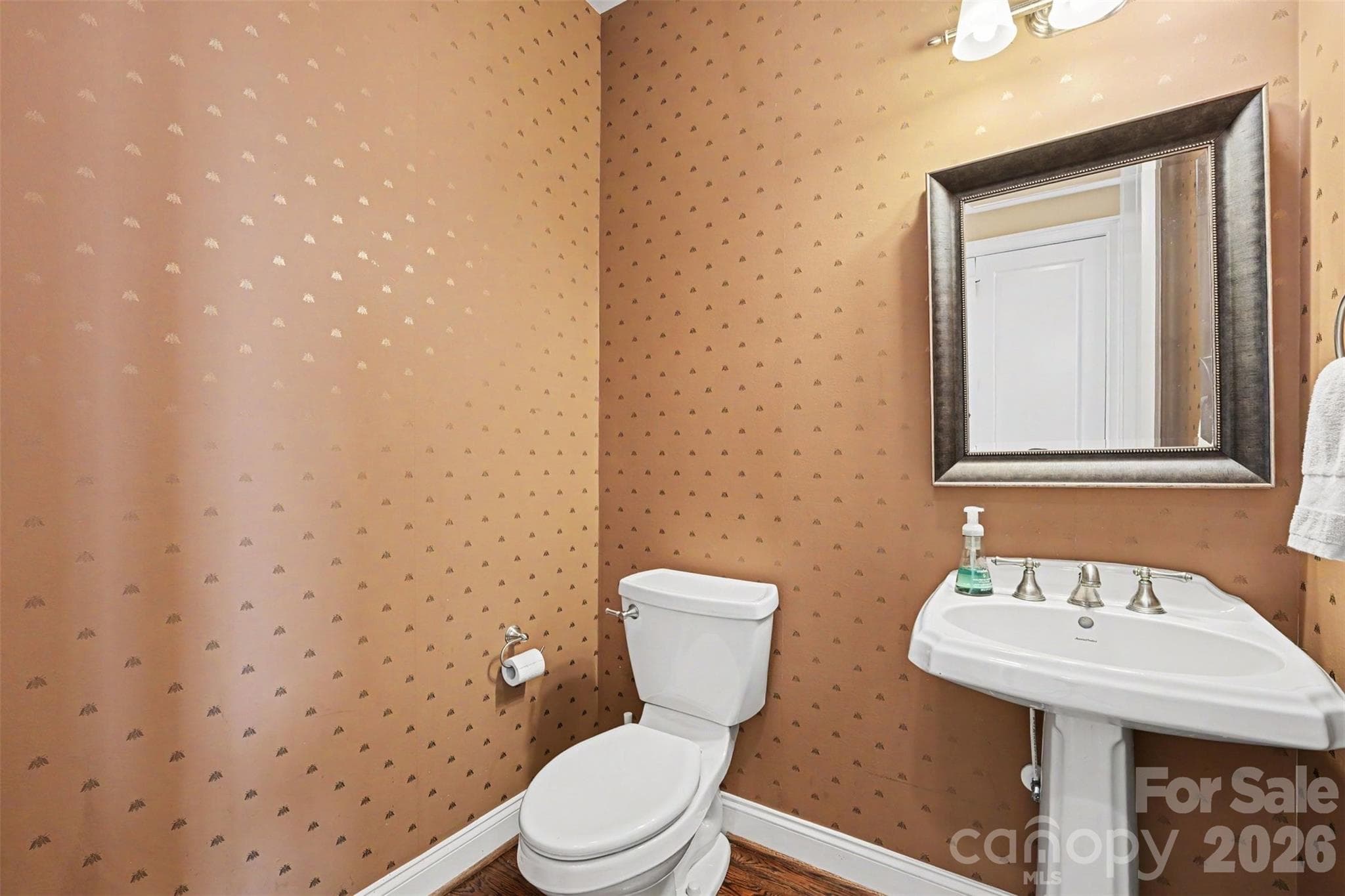 Powder room with Thibaut wallpaper. - 120 Palos Verde Drive, Mooresville