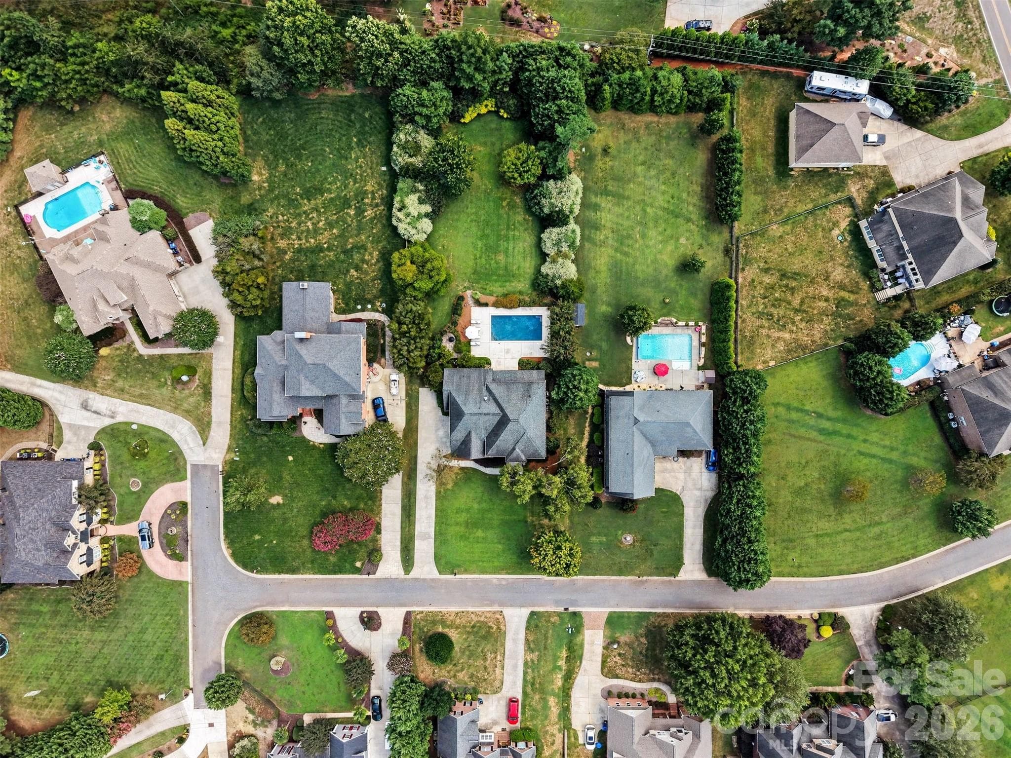 The mature landscaping around this backyard is perfect for privacy. - 120 Palos Verde Drive, Mooresville