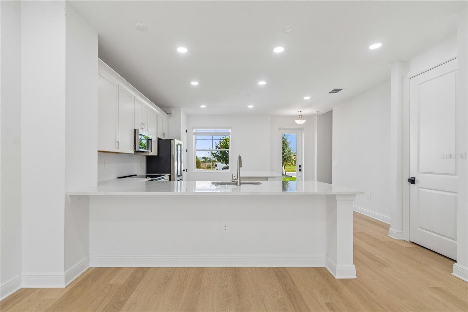 Kitchen-Photo description represents the model home of same floor plan. - 17830 BROADLEAF LOOP, VENICE