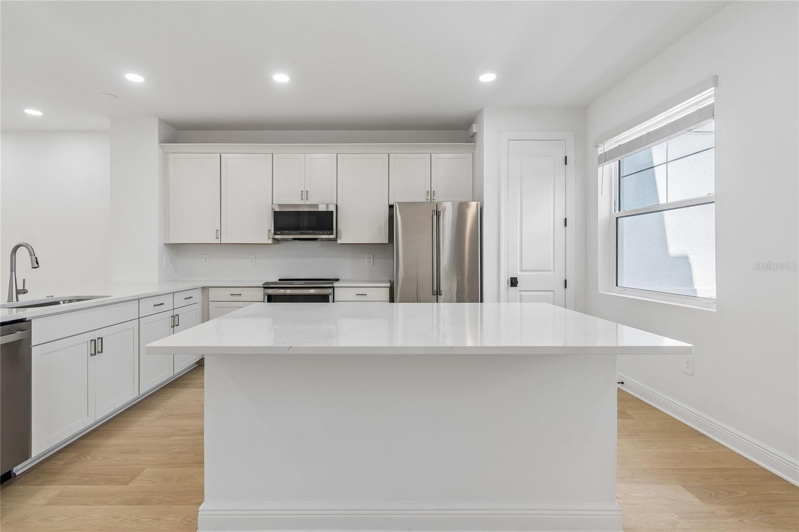 Kitchen-Photo description represents the model home of same floor plan. - 17830 BROADLEAF LOOP, VENICE