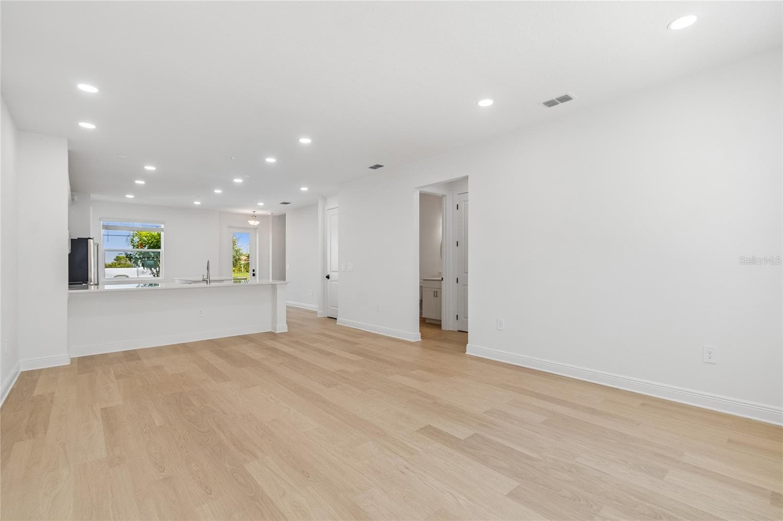 Great Room-Photo description represents the model home of same floor plan. - 17830 BROADLEAF LOOP, VENICE