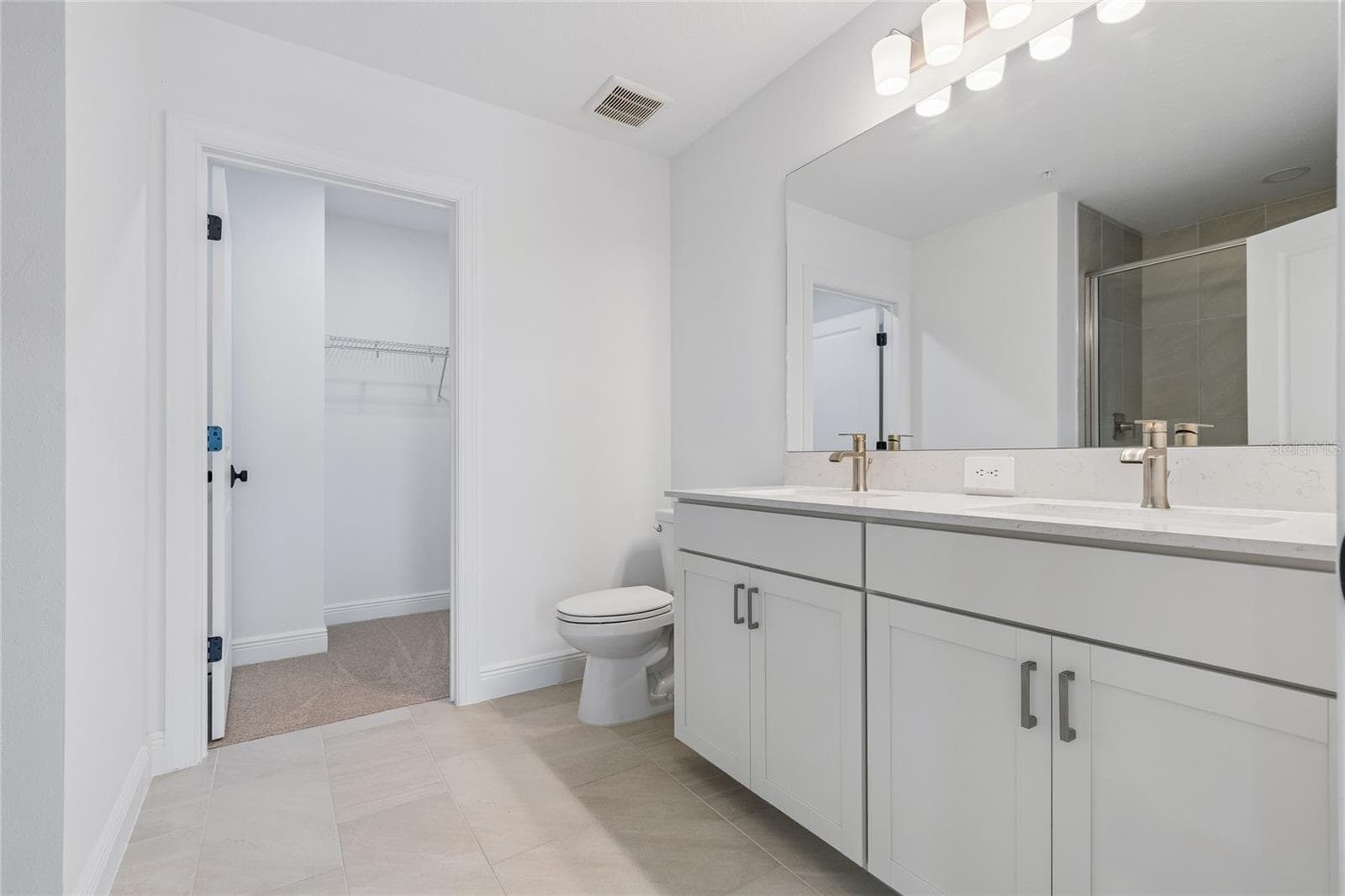 Primary Bath-Photo description represents the model home of same floor plan. - 17830 BROADLEAF LOOP, VENICE