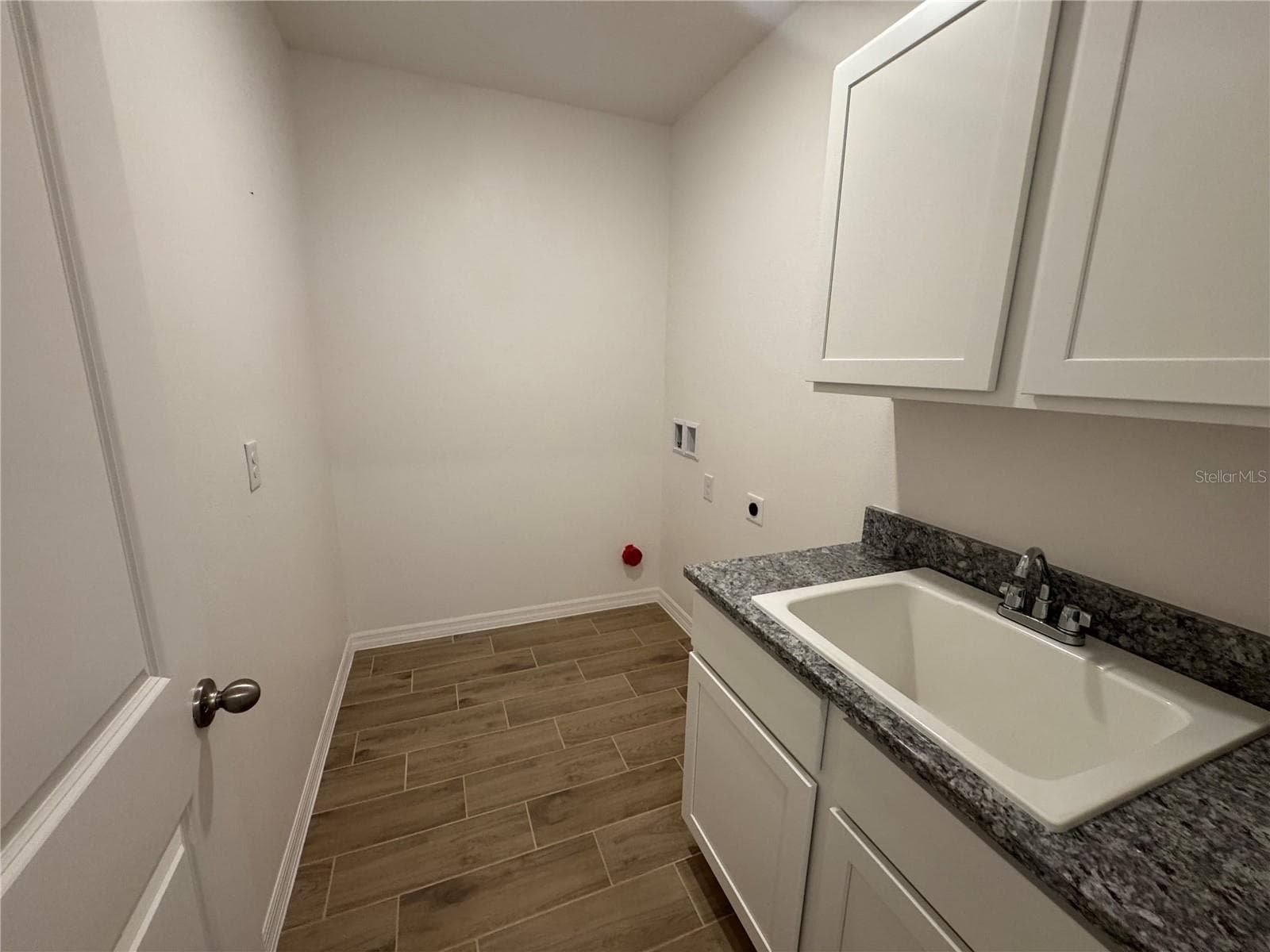 Laundry Room with upper & lower cabinets & utility sink - 4144 SILKTREE CT, POINCIANA