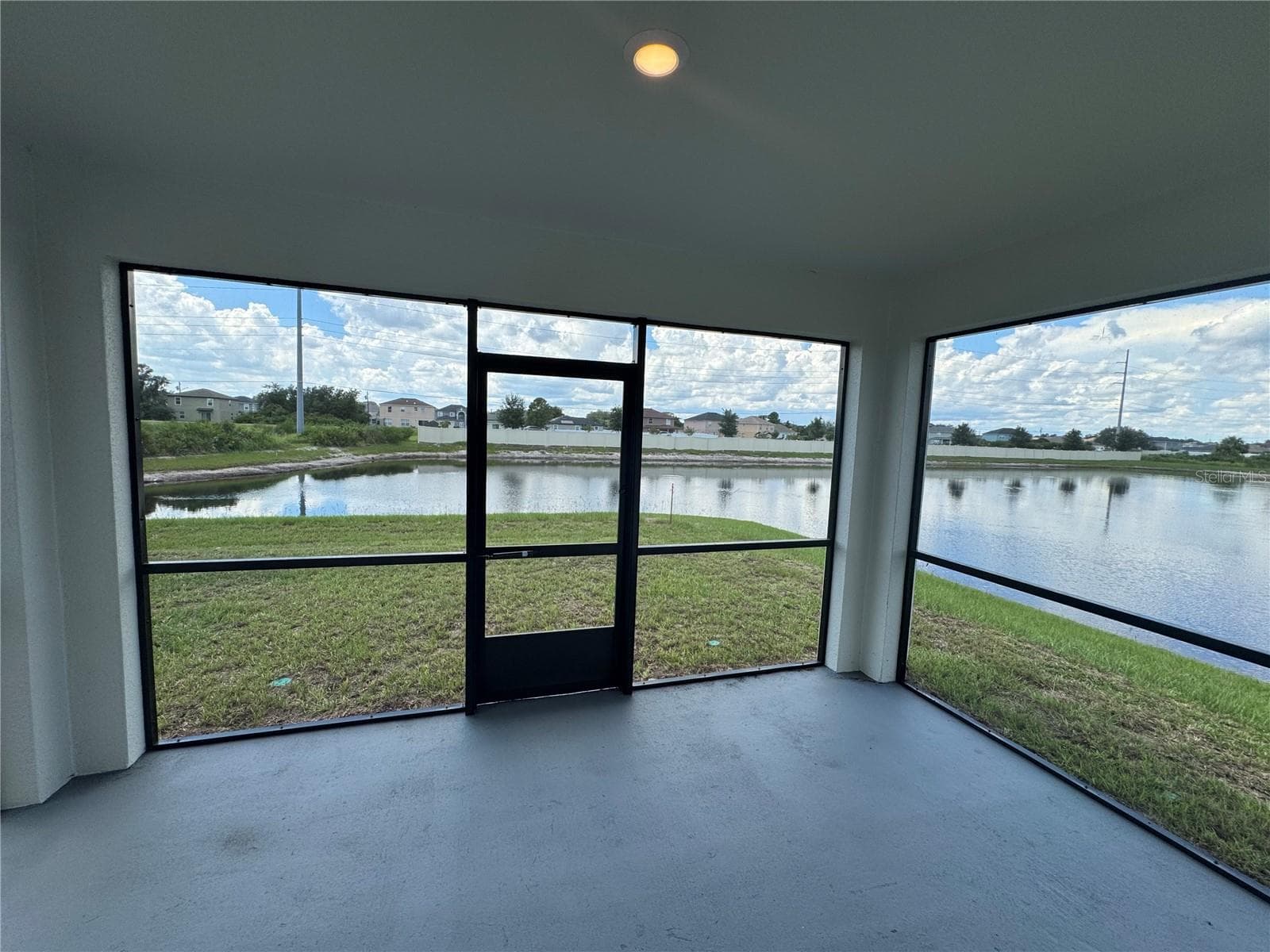 Screened-in Lanai with water views! - 4144 SILKTREE CT, POINCIANA
