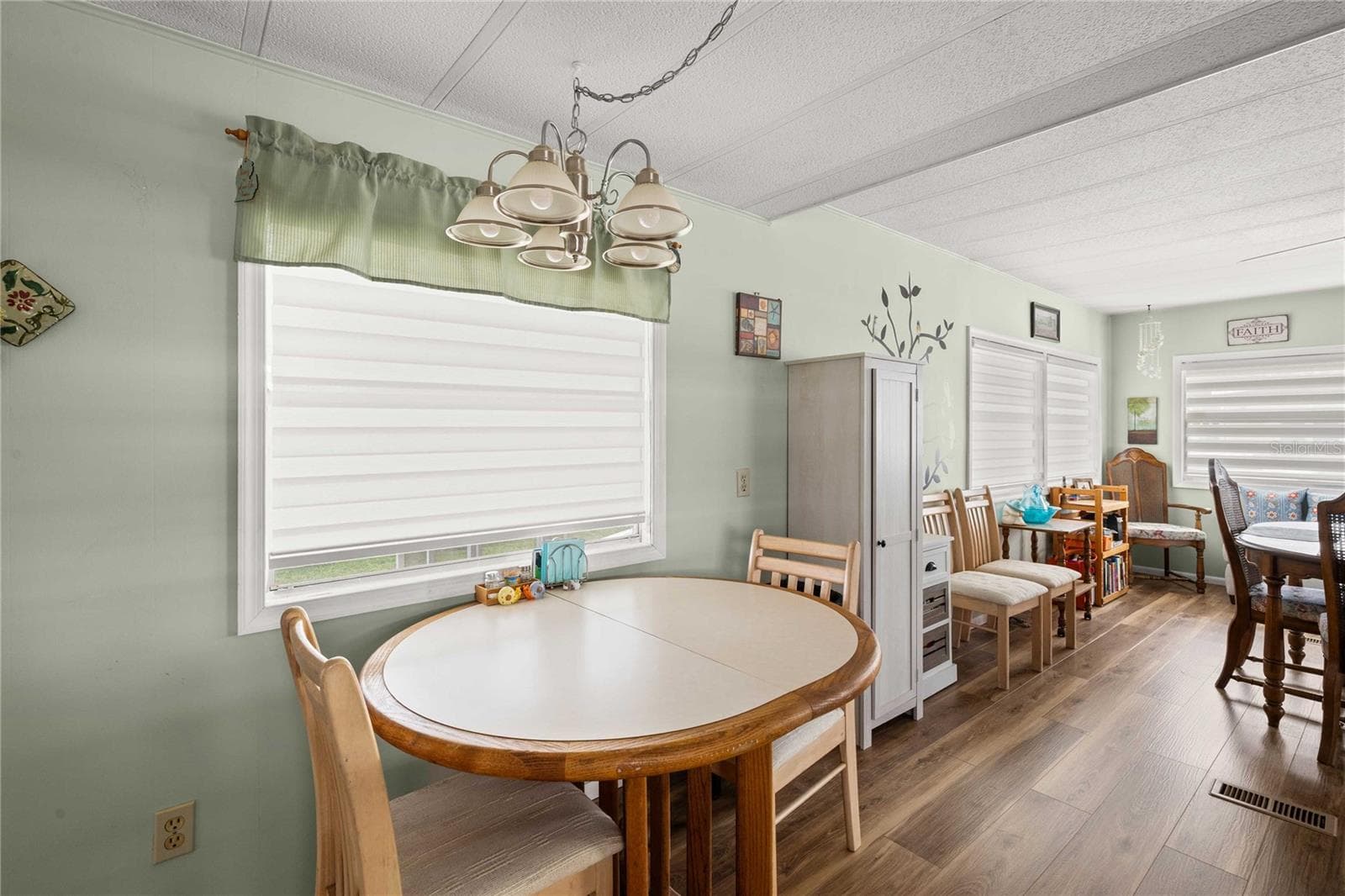 There is an eat-in area in the kitchen too - 36917 GRACE AVE, ZEPHYRHILLS