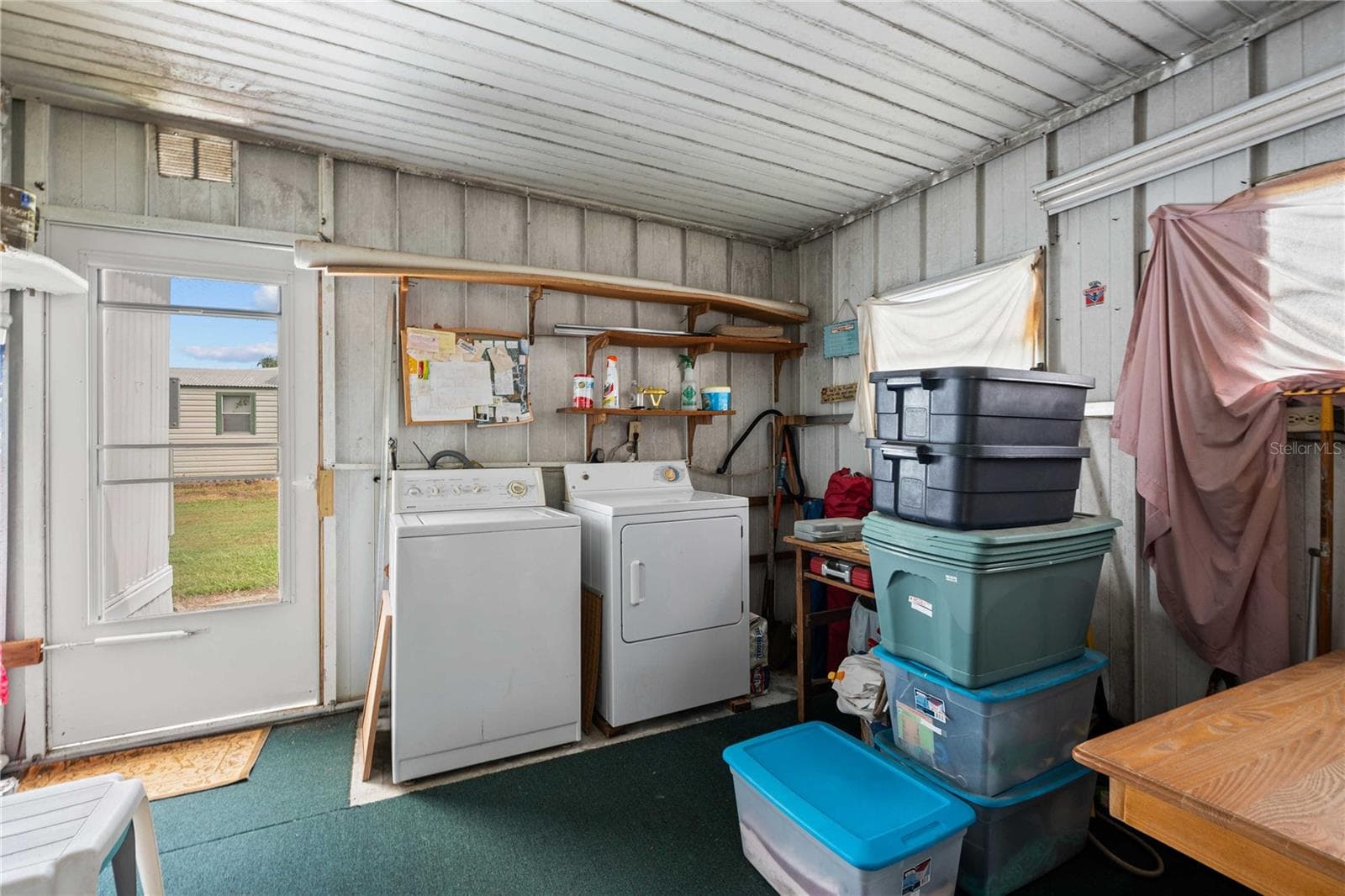 The laundry can be accessed from the screen room or the interior hall - 36917 GRACE AVE, ZEPHYRHILLS