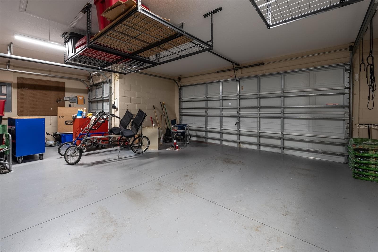 Garage with Hanging storage racks - 16320 SW 13TH TER, OCALA