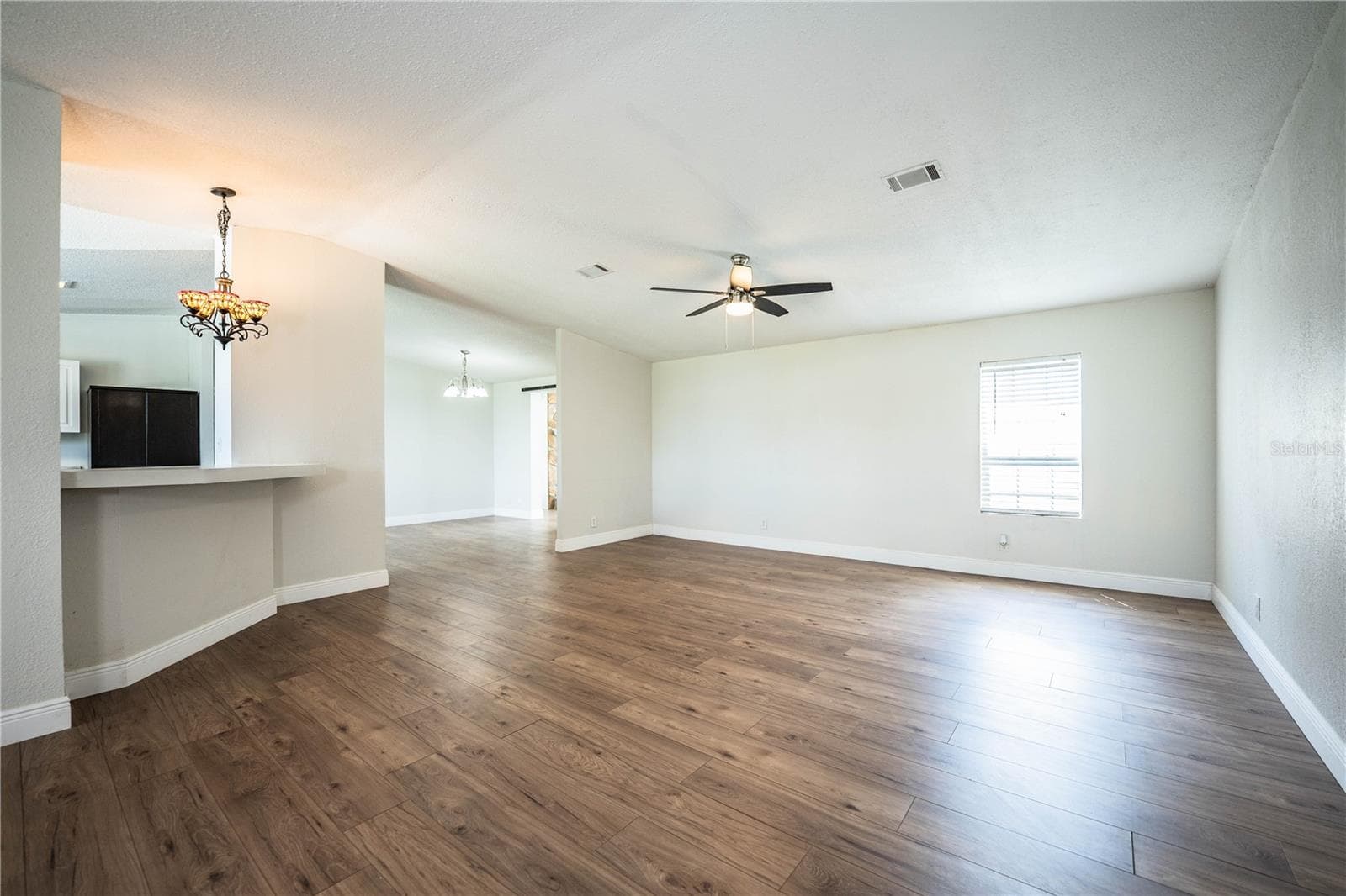 Living Room looking at kitchen and dining room - 8045 ALTURAS BABSON PARK CUTOFF RD, BARTOW