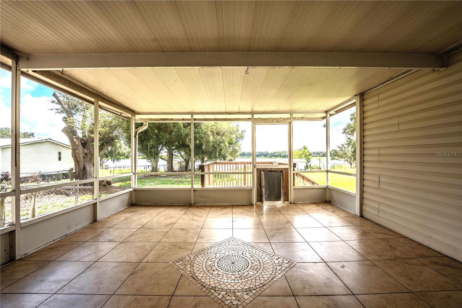 Screened porch looking at lake - 8045 ALTURAS BABSON PARK CUTOFF RD, BARTOW