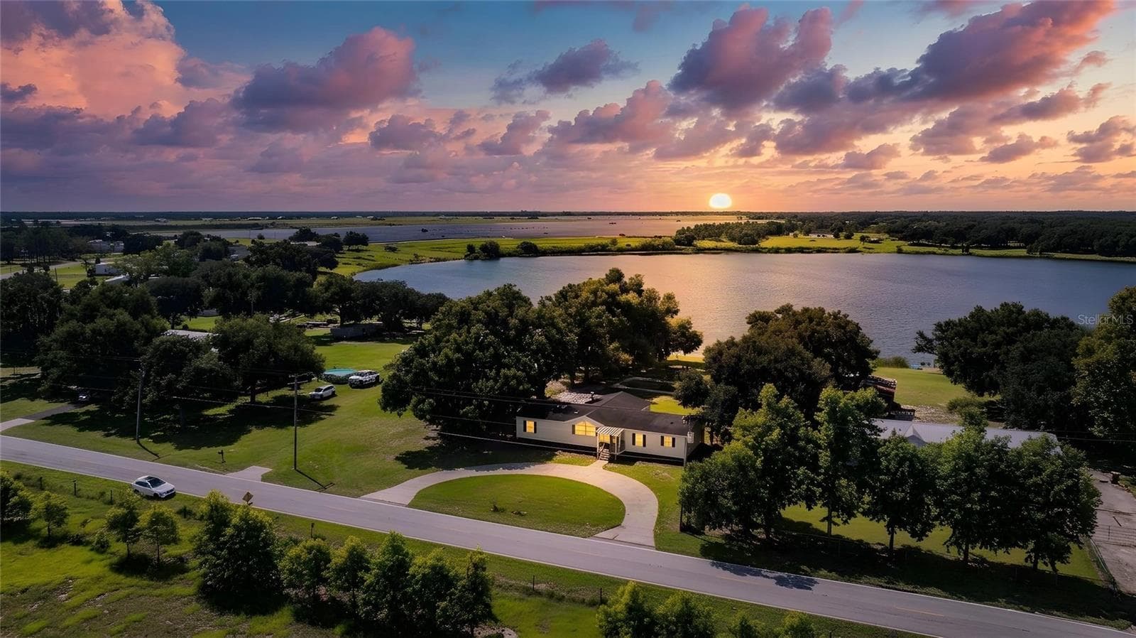 Front of house with view of Lake Walker - twilight - 8045 ALTURAS BABSON PARK CUTOFF RD, BARTOW