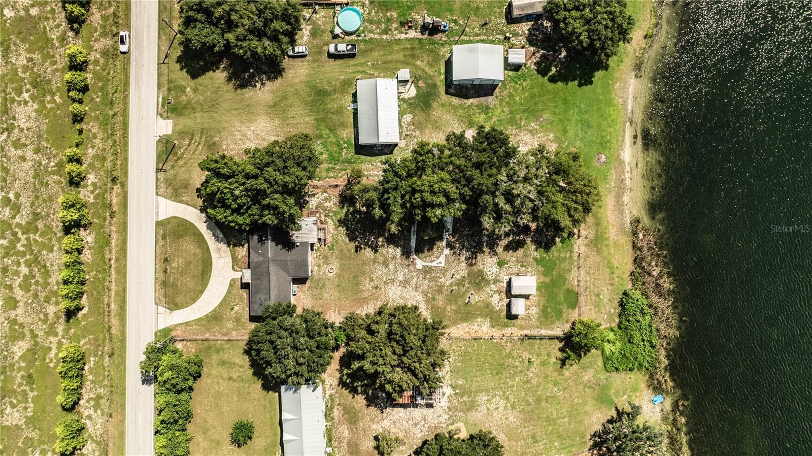 Aerial of house and lake - 8045 ALTURAS BABSON PARK CUTOFF RD, BARTOW