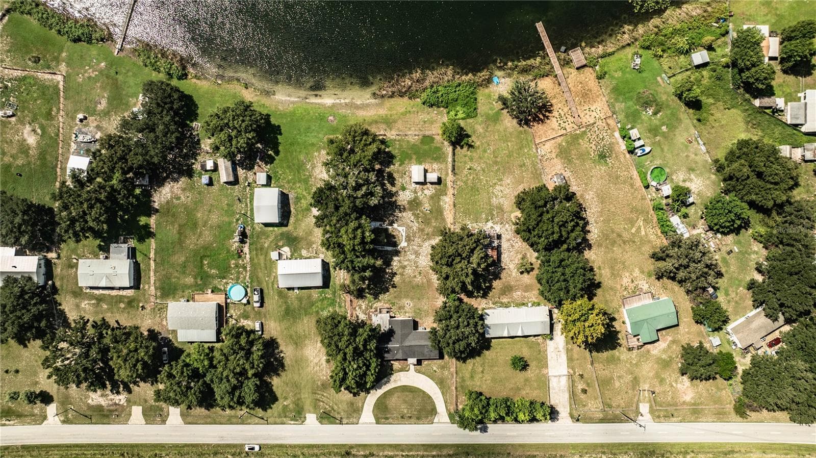 Aerial of house with lake - 8045 ALTURAS BABSON PARK CUTOFF RD, BARTOW