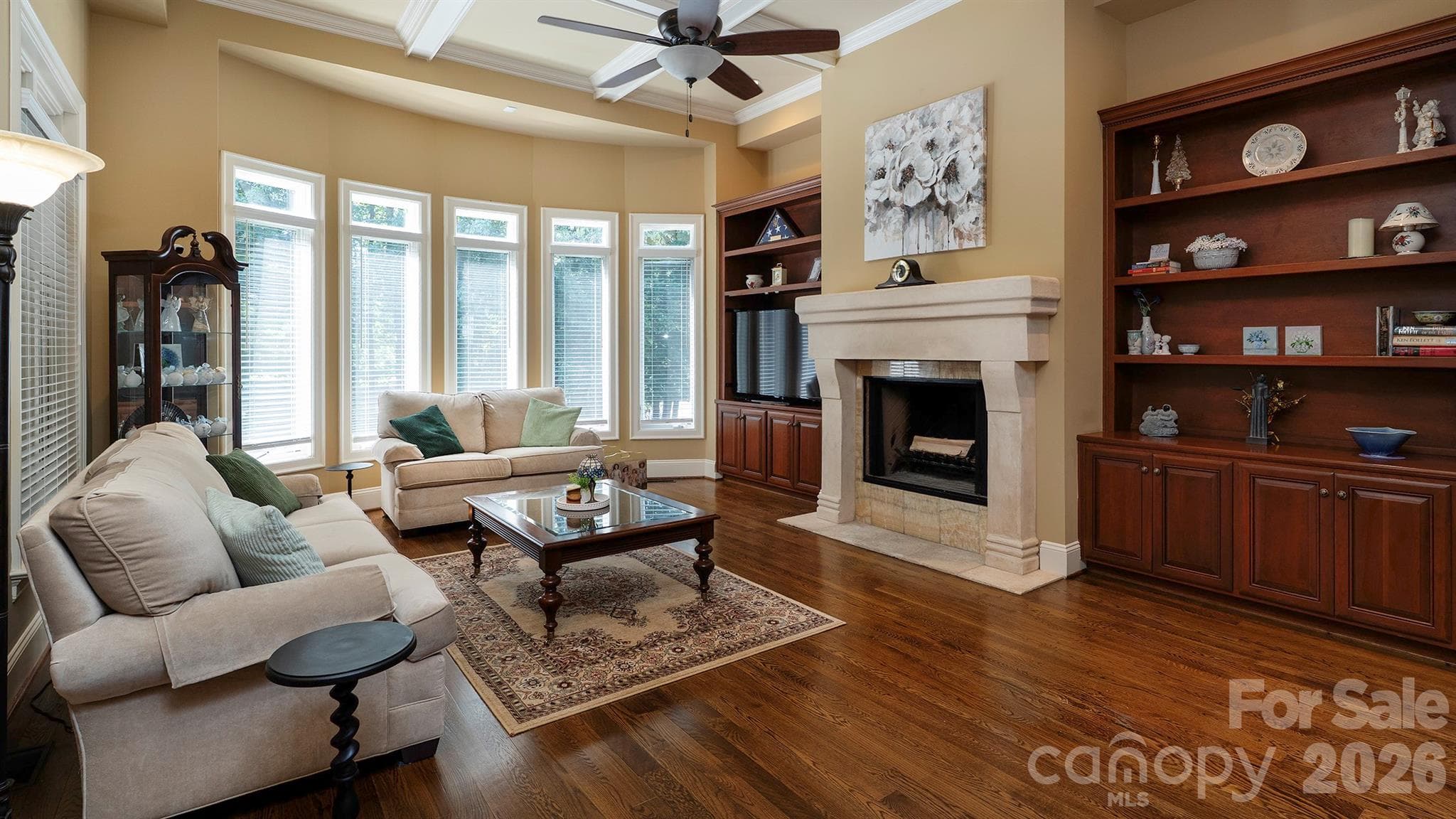 Wood burning fireplace and book shelves... - 7786 Chapel Creek Drive, Denver