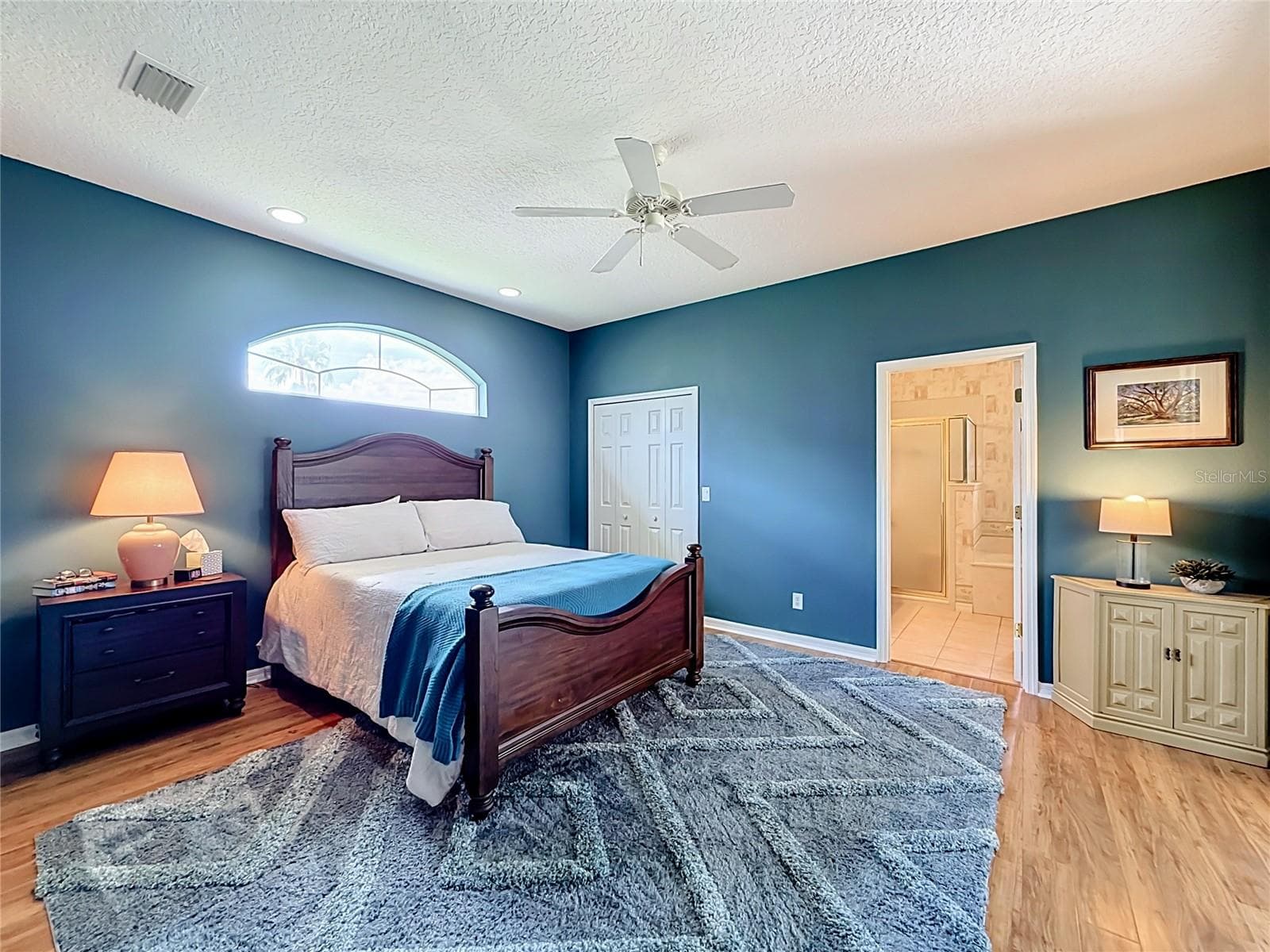 Primary Bedroom with Sliders to Lanai and Large Walk-in Closet - 5693 GULF STREAM STREET, TAVARES