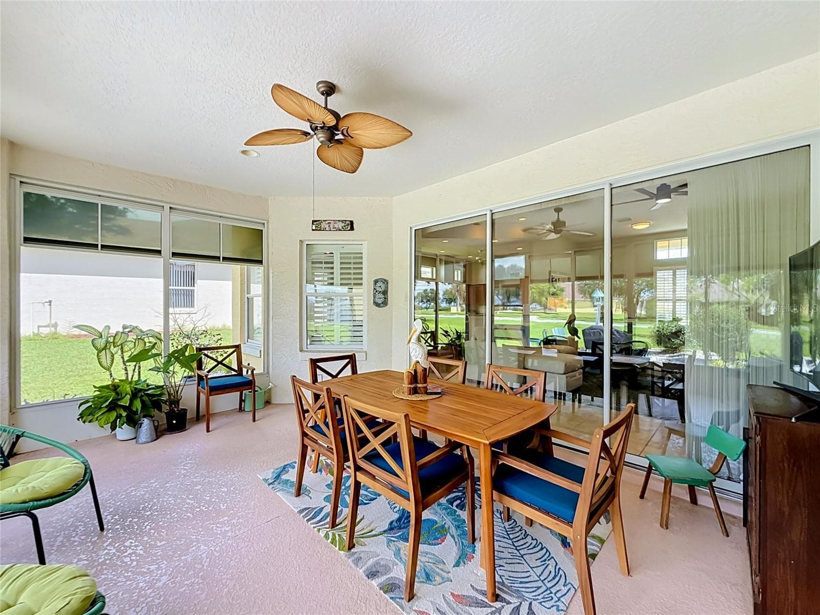 Plexiglass (acrylic) hung windows provide a lightweight, shatter-resistant alternative to glass and enclose the lanai. - 5693 GULF STREAM STREET, TAVARES