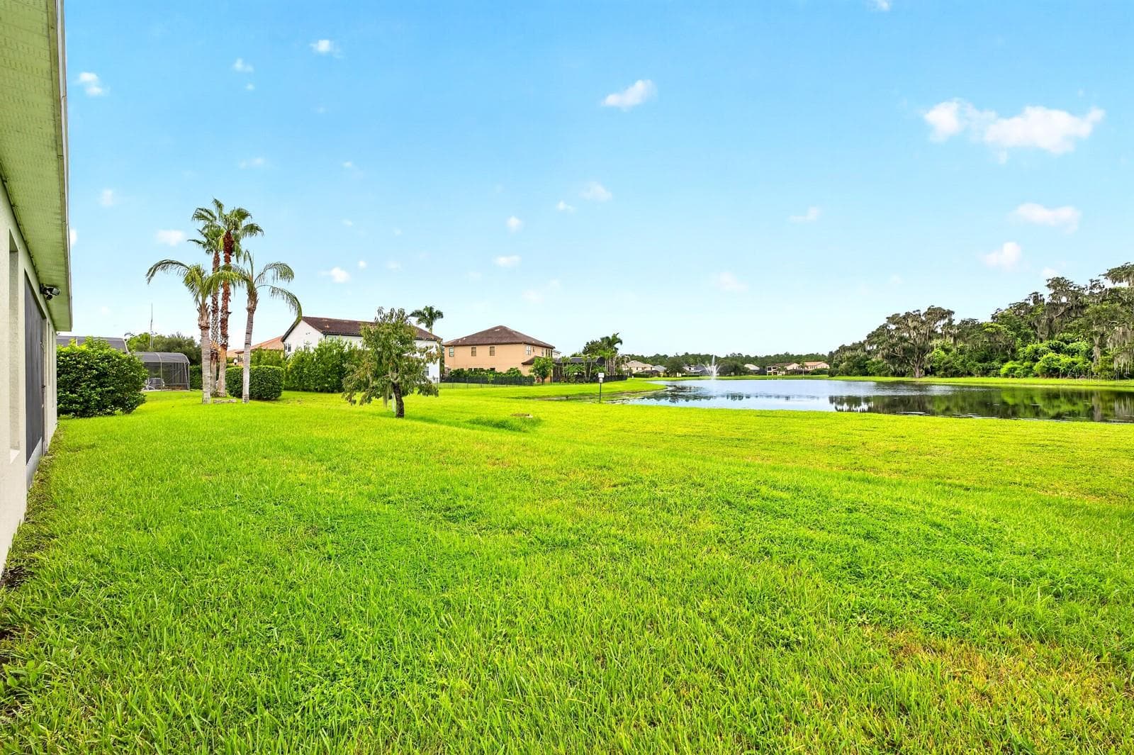 Backyard, pond views. - 4946 LAZY OAKS WAY, ST CLOUD