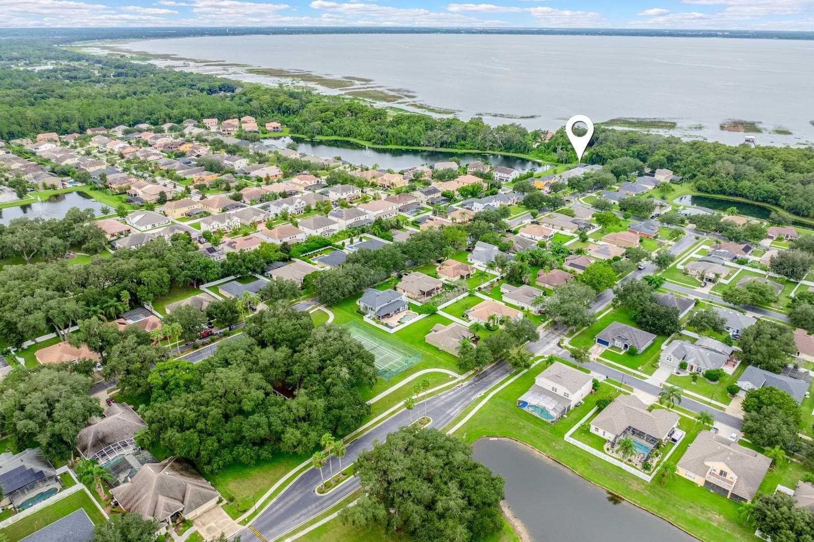 East Lake Toho shimmers as the backdrop to this community. - 4946 LAZY OAKS WAY, ST CLOUD