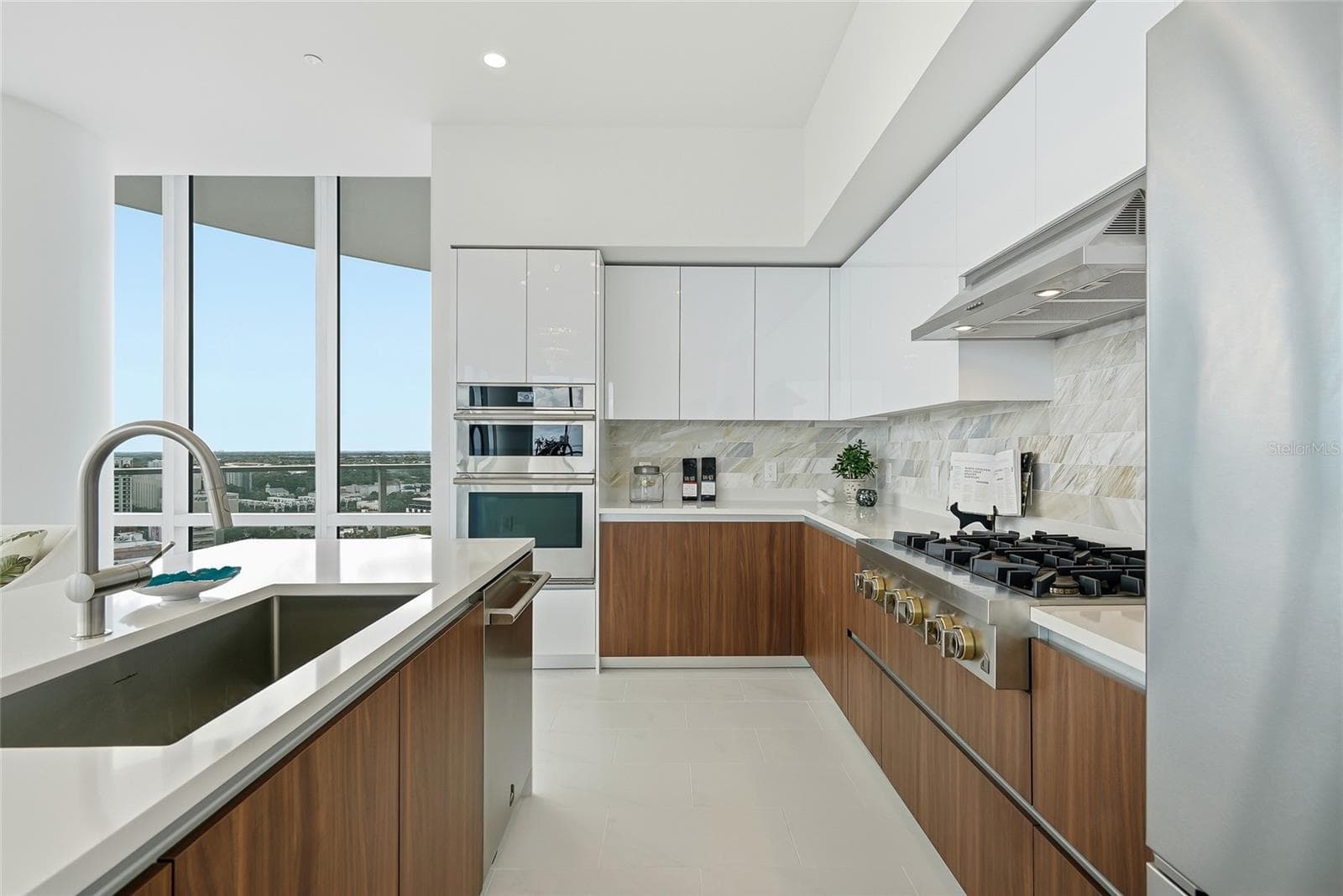 Premium JennAir appliances, contemporary cabinetry, and a generous gathering island. - 400 CENTRAL AVE #1901, ST PETERSBURG