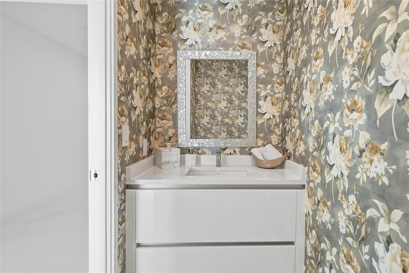 Convenient half bath near the kitchen and living areas, perfect for guests. - 400 CENTRAL AVE #1901, ST PETERSBURG