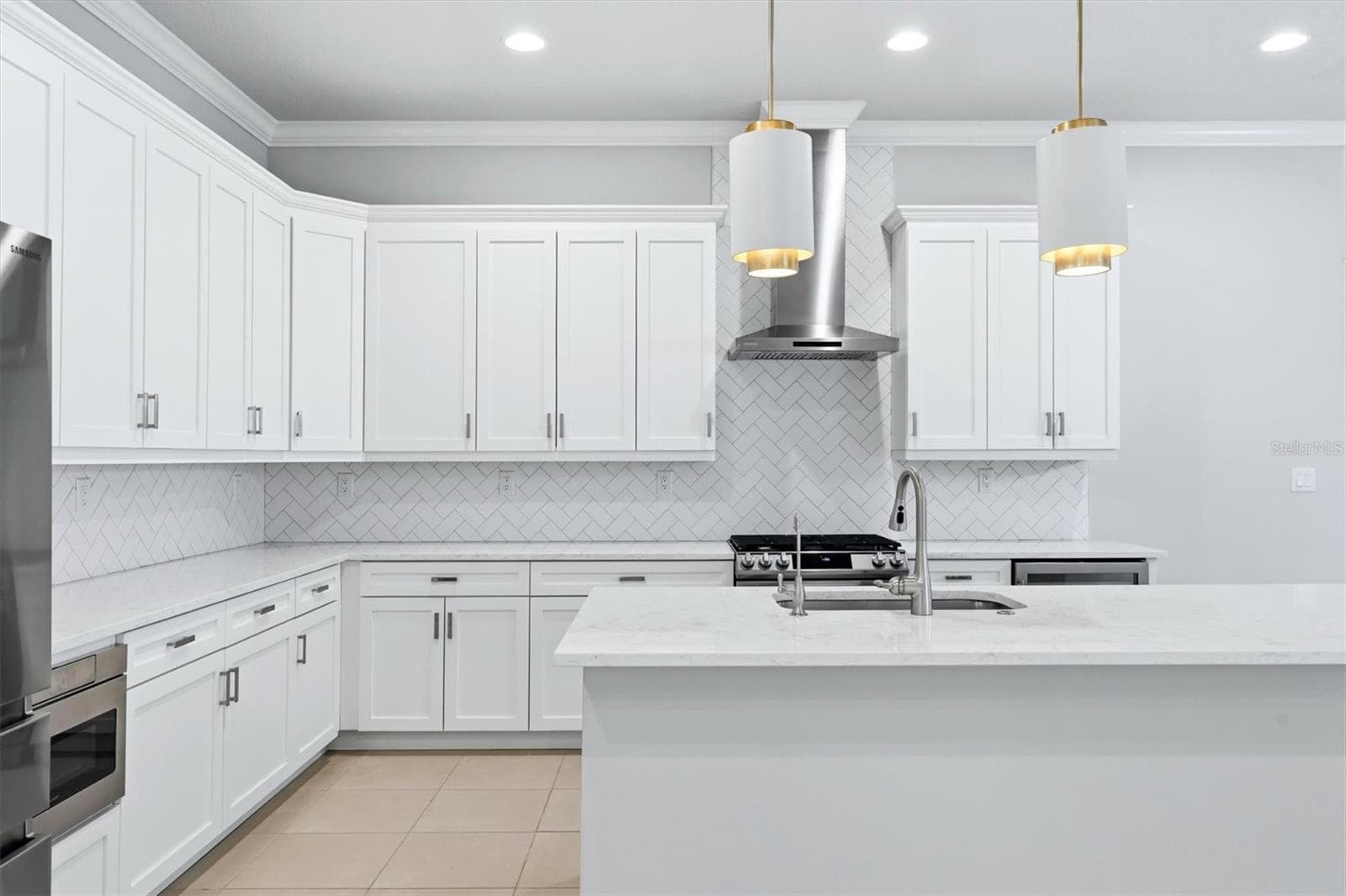 Elegant Herringbone Tile Backsplash - 7717 SANDHILL LAKE DR, SARASOTA