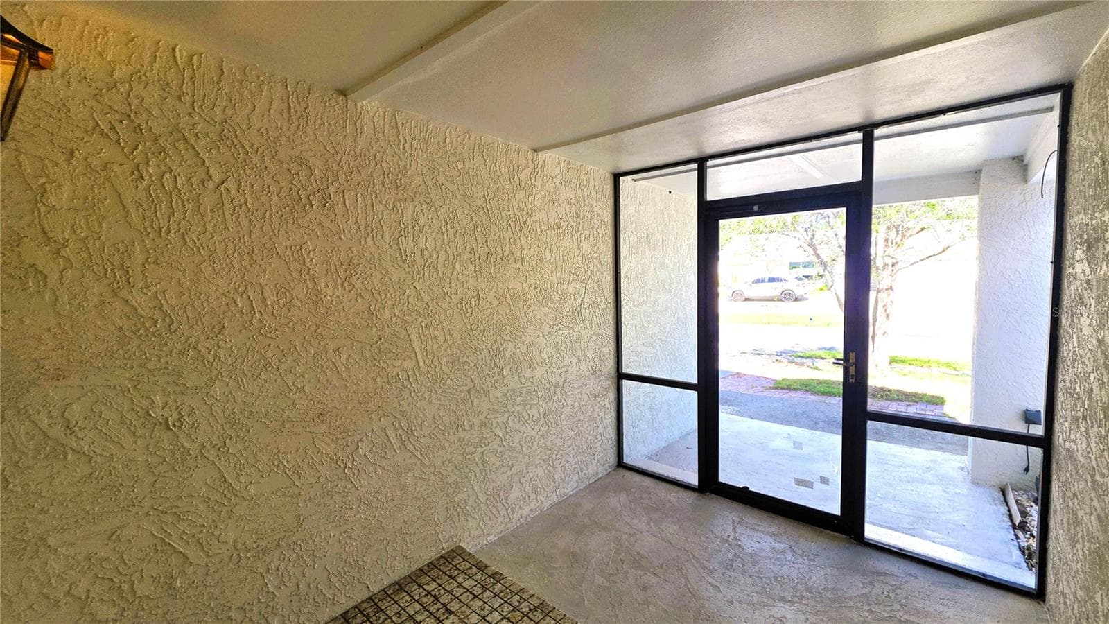 Covered, screened-in front porch. - 2529 INDIGO DR, DUNEDIN