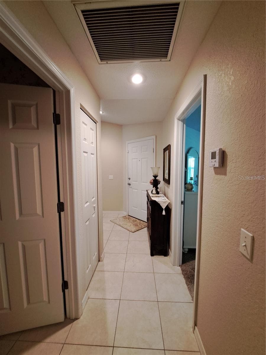 left side walkway when enter home door - 5316 LOCHMEAD TER, ZEPHYRHILLS