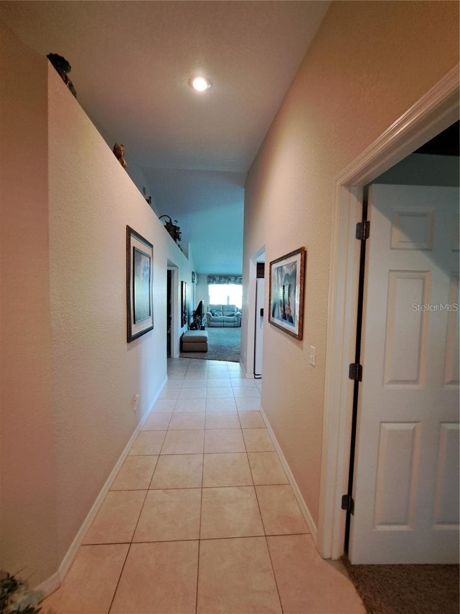 hallway to master, LR and kitchen as a part of this Split Plan - 5316 LOCHMEAD TER, ZEPHYRHILLS