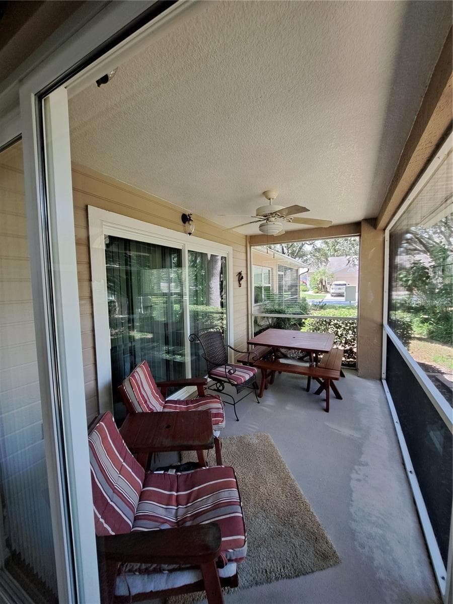 Back side screened porch - 5316 LOCHMEAD TER, ZEPHYRHILLS
