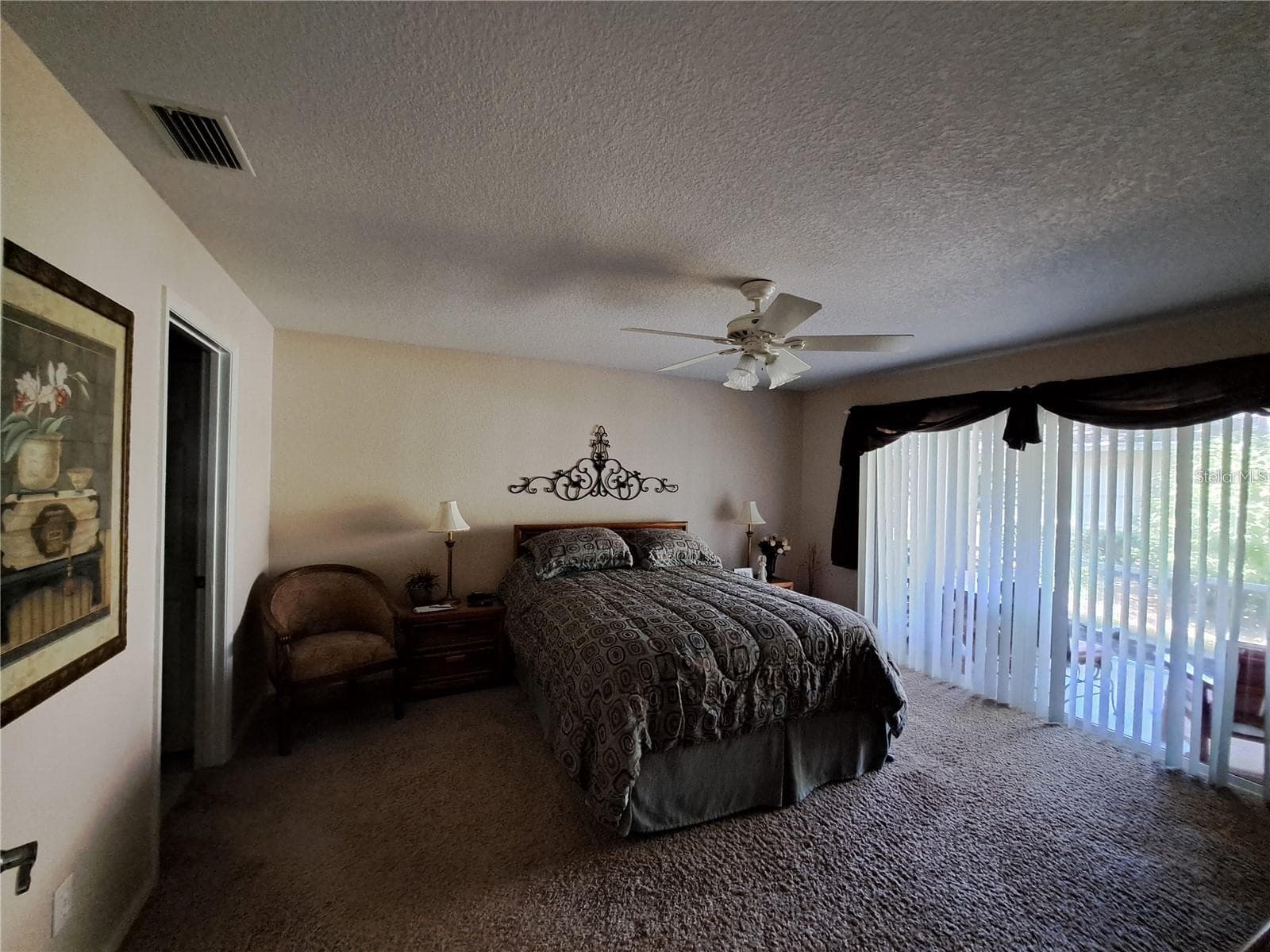 Master with new double glass hurricane protected sliding doors to back screened porch - 5316 LOCHMEAD TER, ZEPHYRHILLS