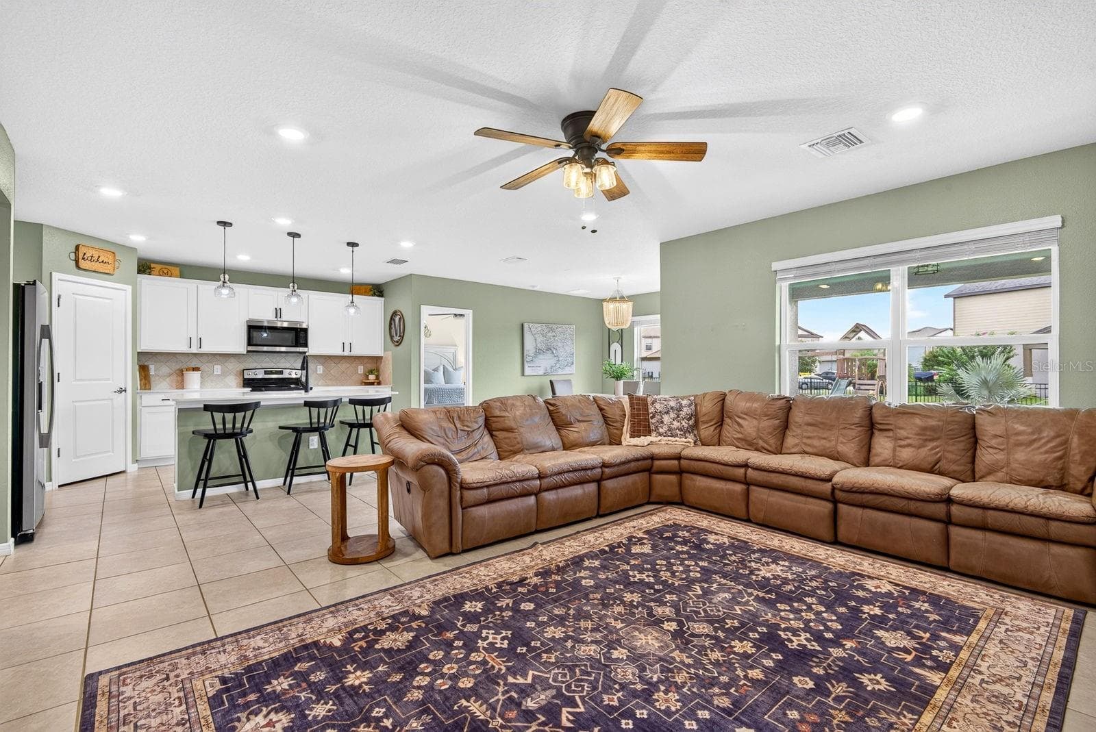 Living area facing open kitchen - 9348 ROYAL RIVER CIR, PARRISH