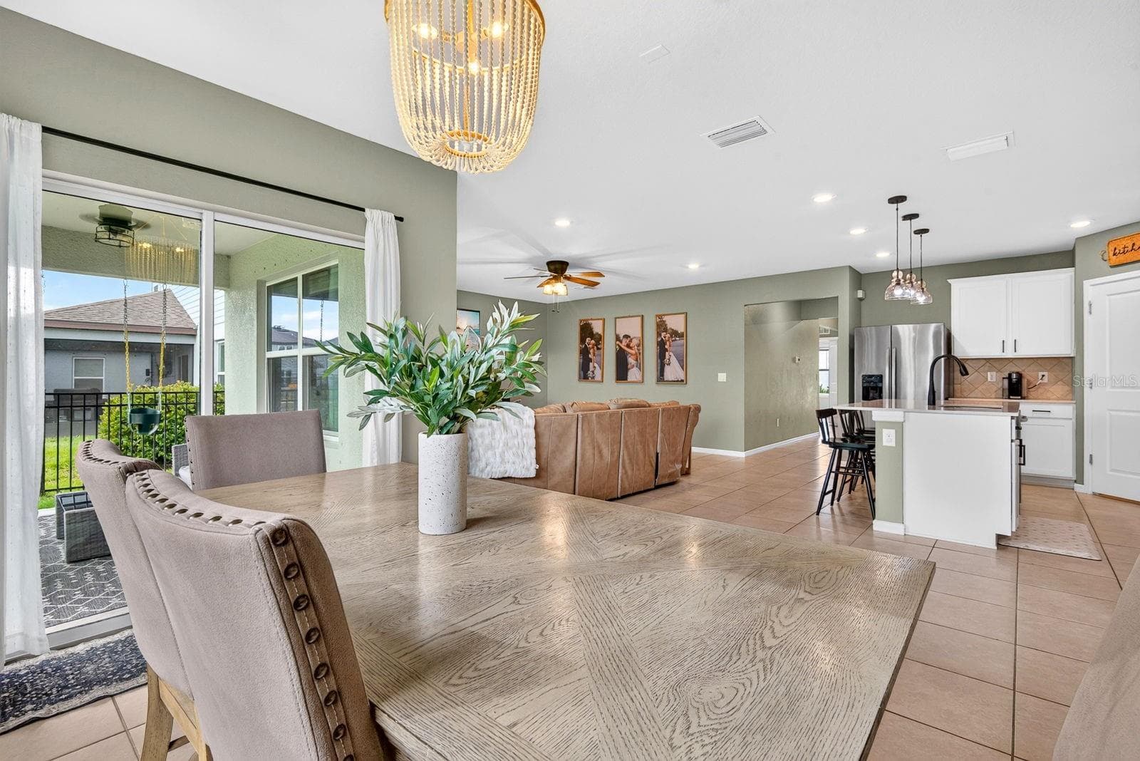 Large dining area in back with covered lanai to the right - 9348 ROYAL RIVER CIR, PARRISH