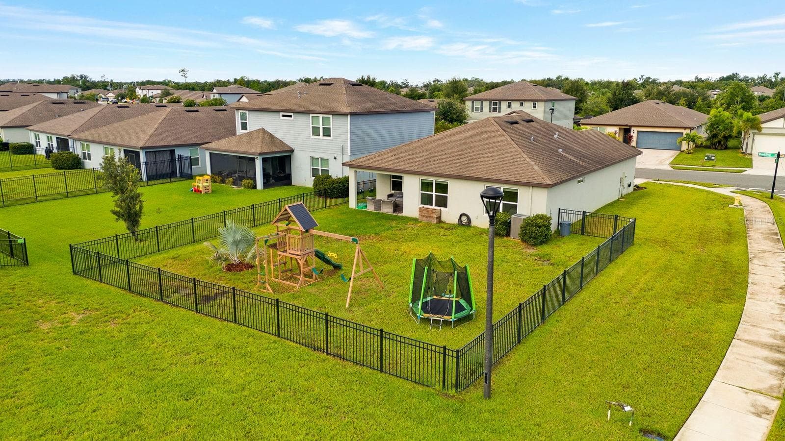 Aerial view of large corner lot and fenced yard - 9348 ROYAL RIVER CIR, PARRISH