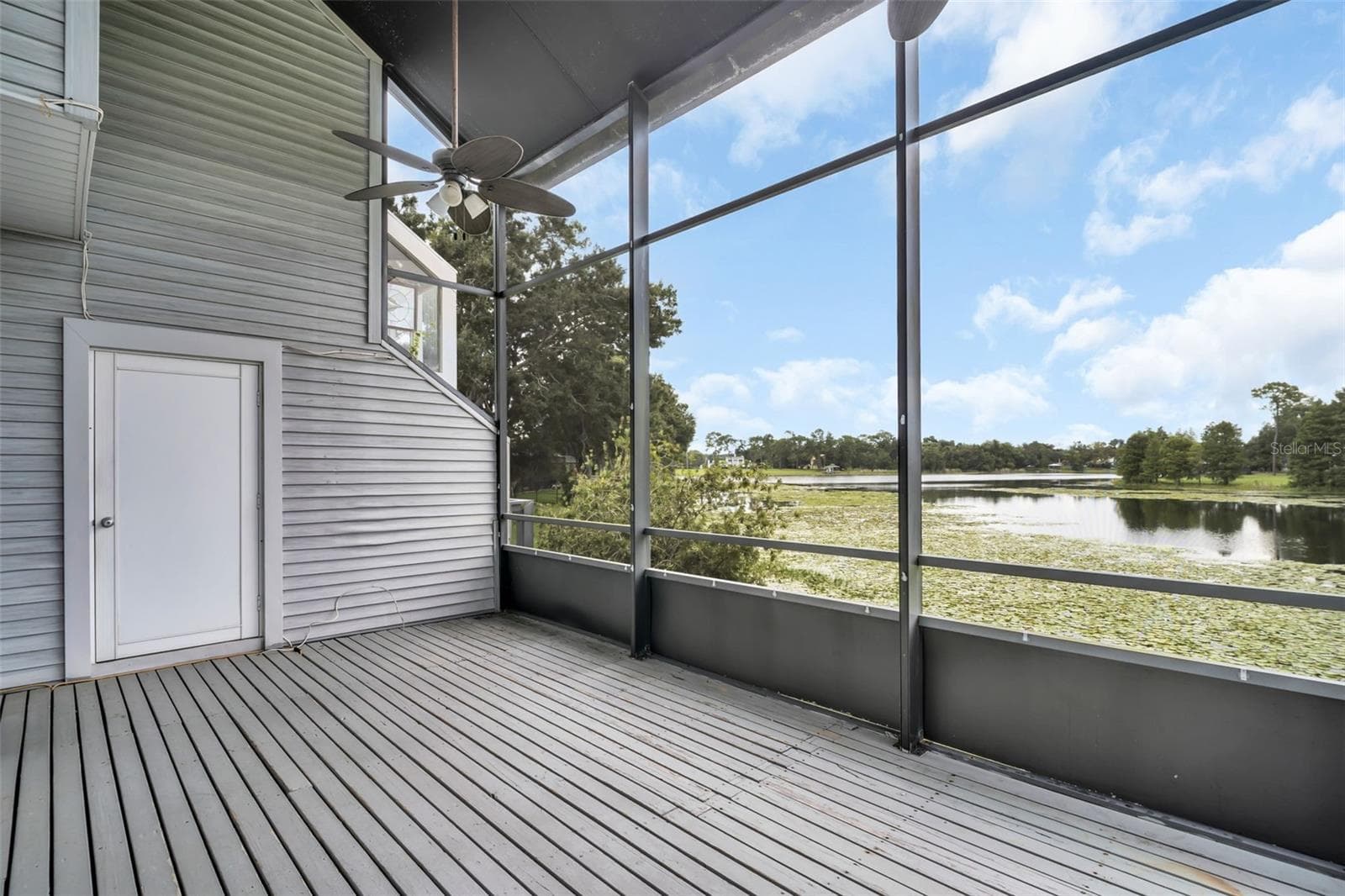 Back screened in patio overlooking Boot Lake - 9723 TIFFANY OAKS LN #3B, TAMPA