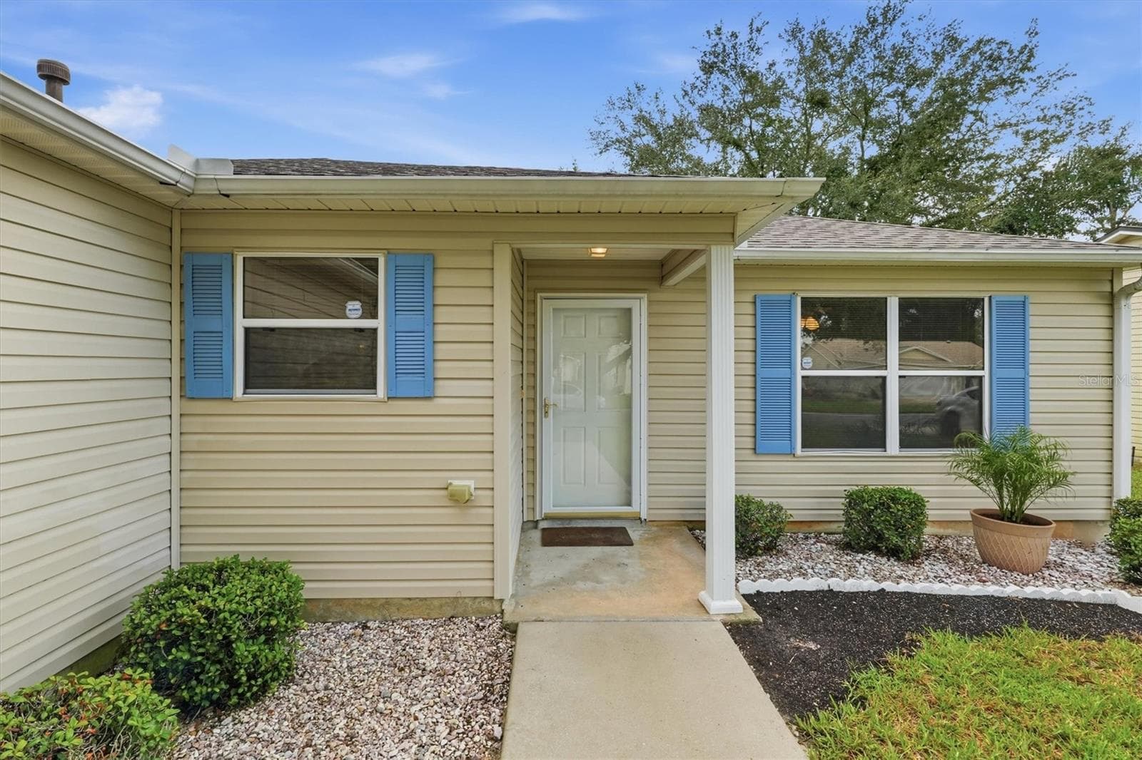 Front exterior:3565 Idlewood Loop exterior – Corpus Christi model home in Village of Summerhill, The Villages FL 32162 - 3565 IDLEWOOD LOOP, THE VILLAGES