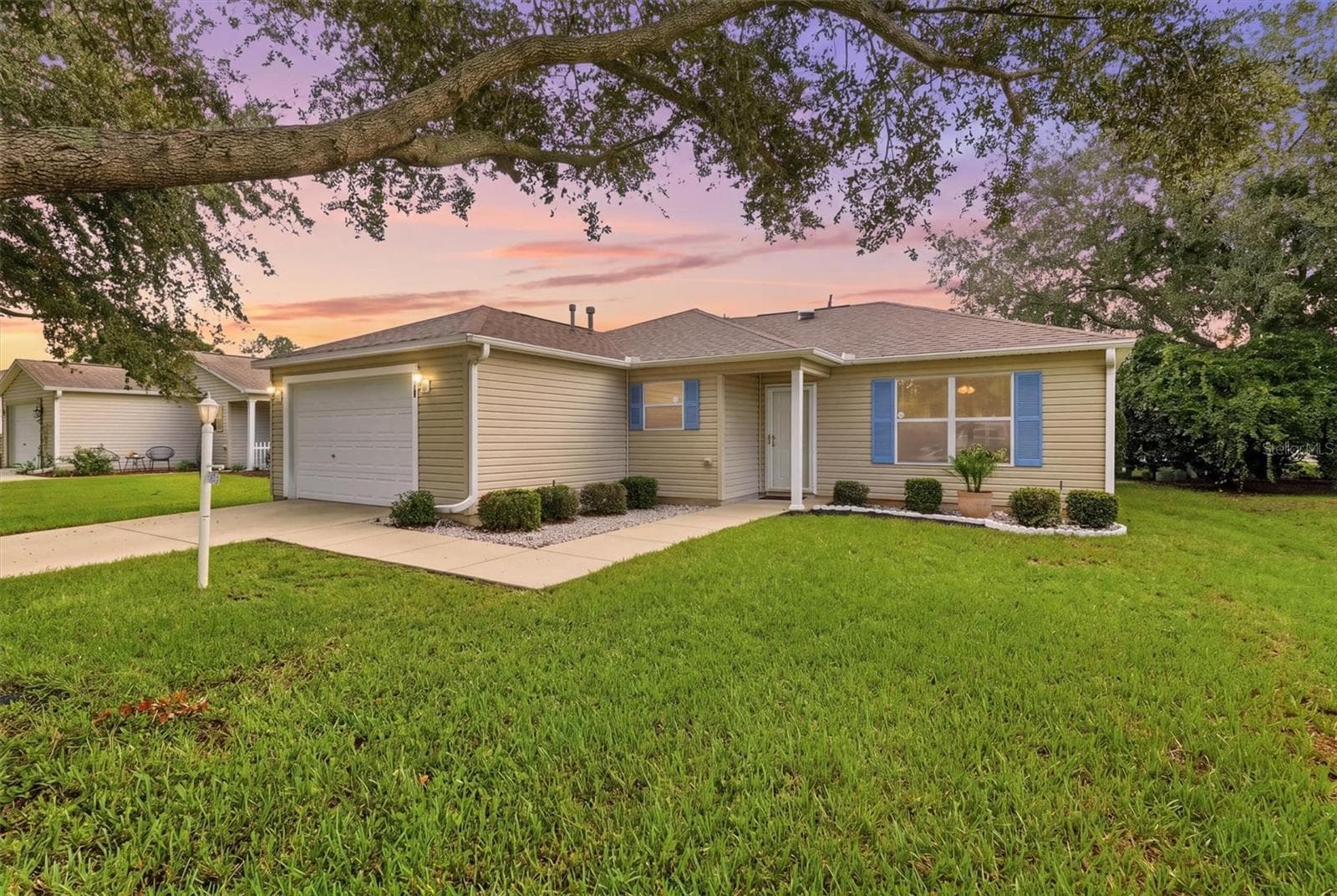 Front exterior:3565 Idlewood Loop exterior – Corpus Christi model home in Village of Summerhill, The Villages FL 32162 - 3565 IDLEWOOD LOOP, THE VILLAGES