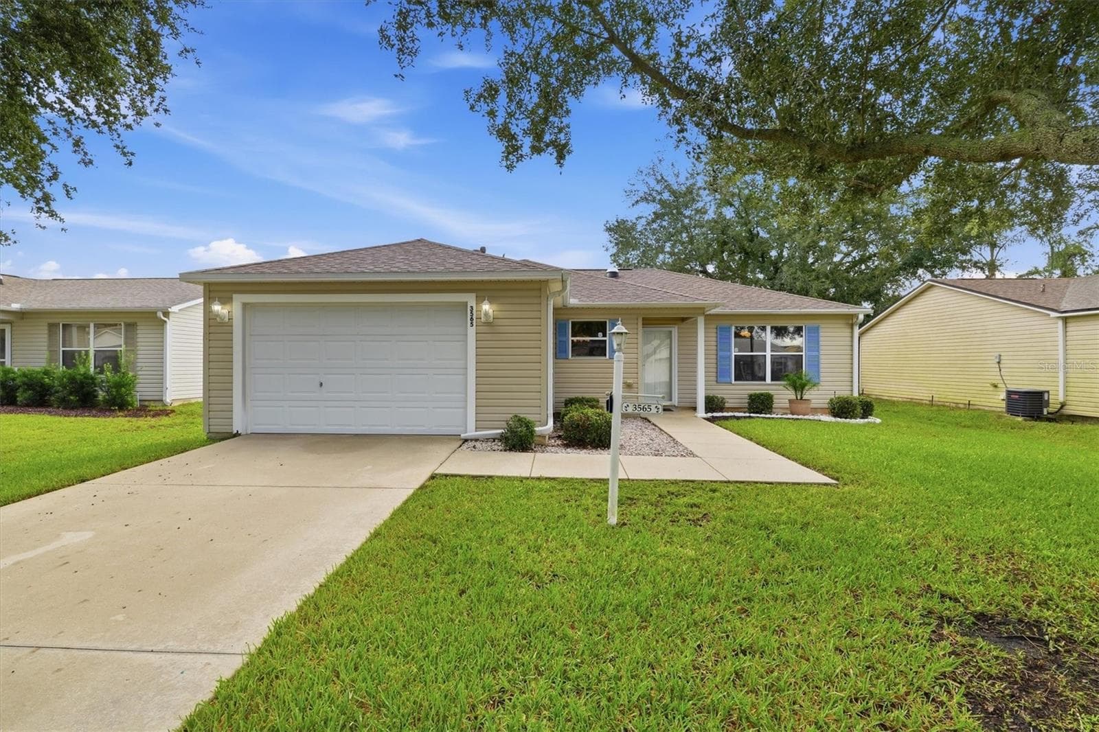 Front exterior:3565 Idlewood Loop exterior – Corpus Christi model home in Village of Summerhill, The Villages FL 32162 - 3565 IDLEWOOD LOOP, THE VILLAGES