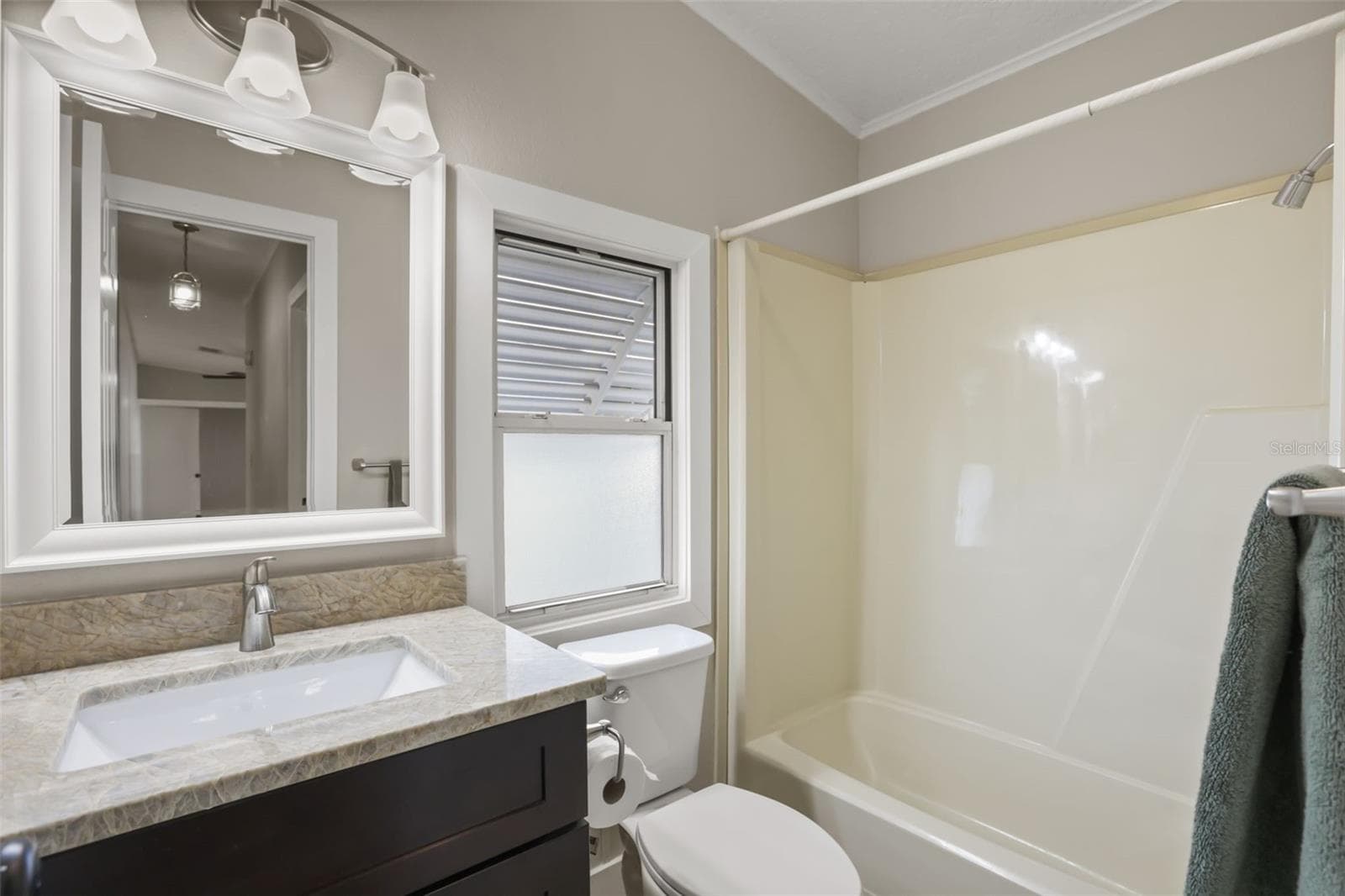 Bathroom #2 with Quartzite Coutertops over new Cabinet - 3928 N CITRUS CIR #691, ZELLWOOD