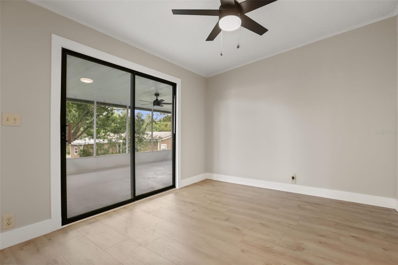 Bedroom 3 has access to the Screened Back Porch - 3928 N CITRUS CIR #691, ZELLWOOD