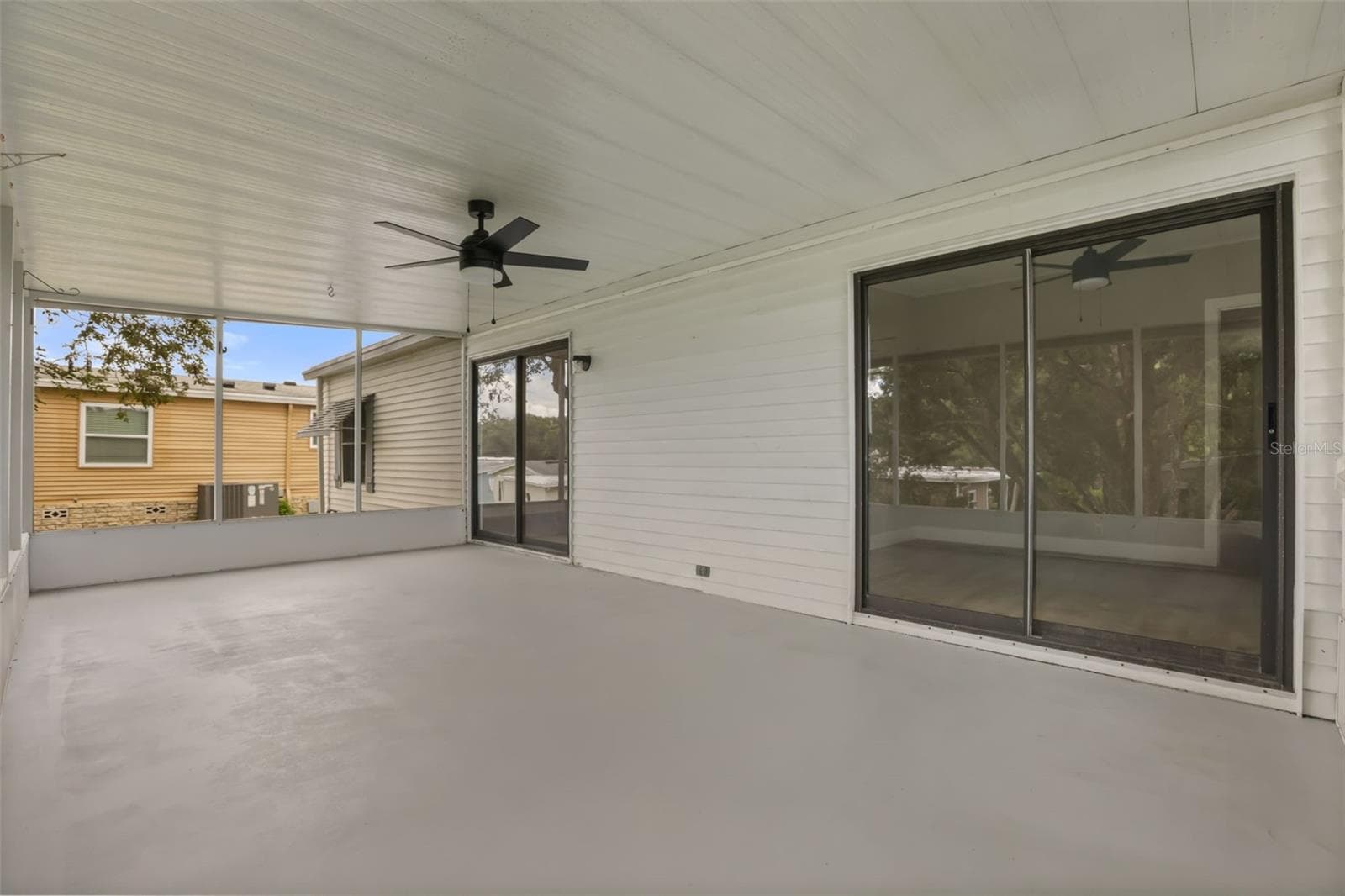 2 Entries to Back Porch From Living Room & Bedroom 3 - 3928 N CITRUS CIR #691, ZELLWOOD