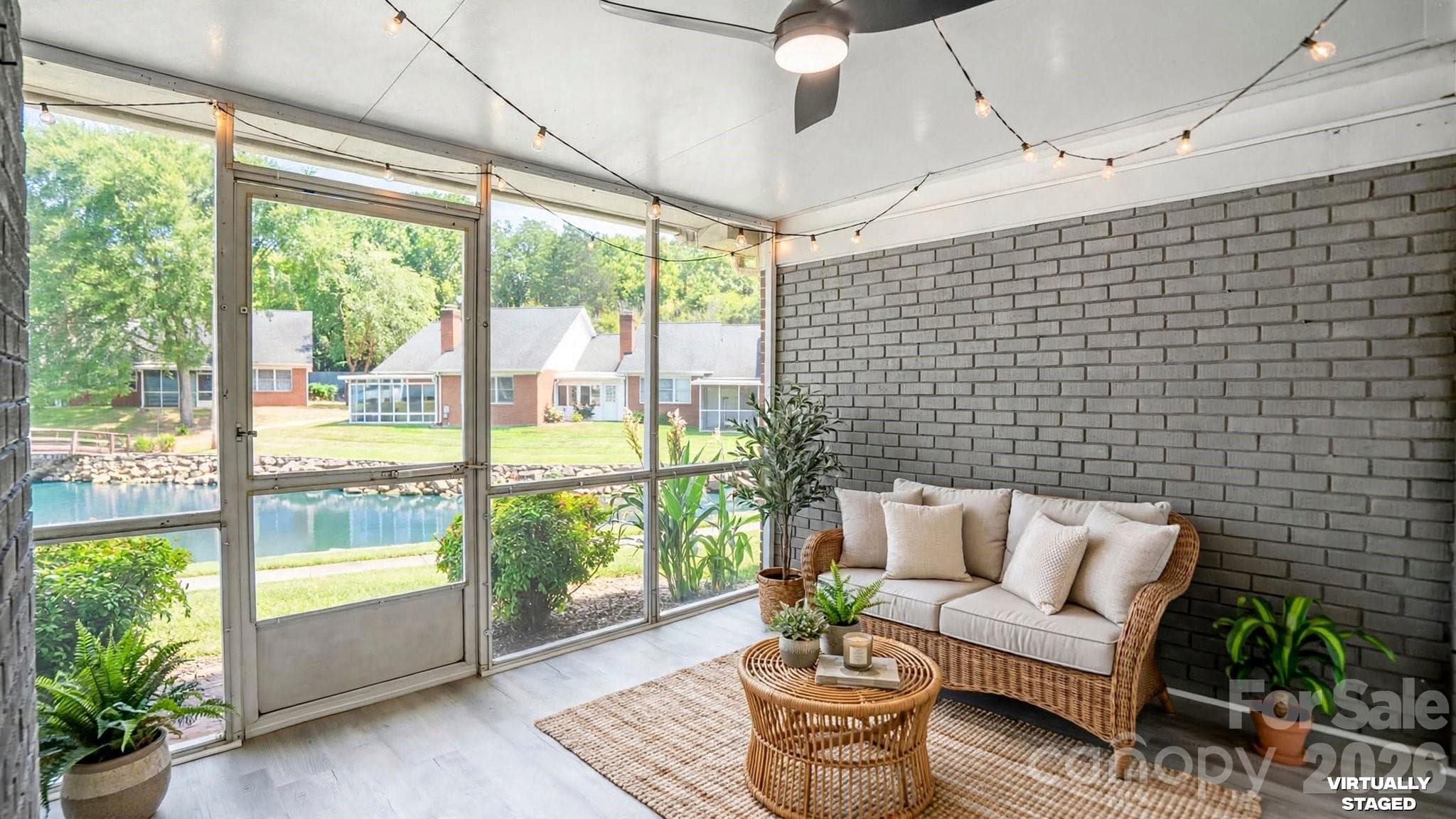 Sunroom overlooking the neighborhood pond, complete with ac register for added comfort - 19942 Oak Leaf Circle, Cornelius