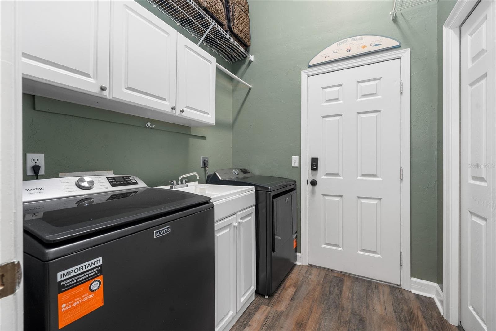 Laundry Room with Sink and Storage - 7503 NW 50TH ST, GAINESVILLE