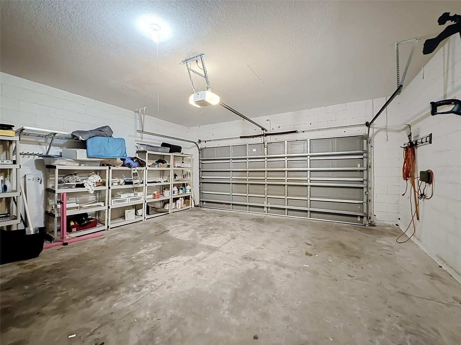 Two-car garage with shelving - 852 N JACKS LAKE RD, CLERMONT