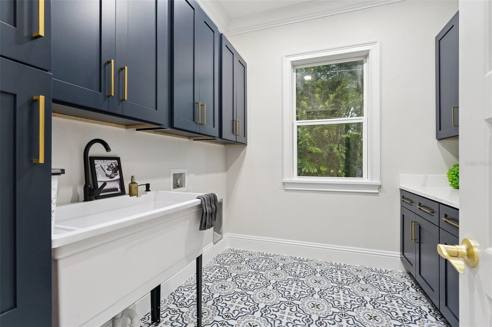 Floors and Cabentry in Laundry are too cute! - 1614 JEANETTE ST, APOPKA
